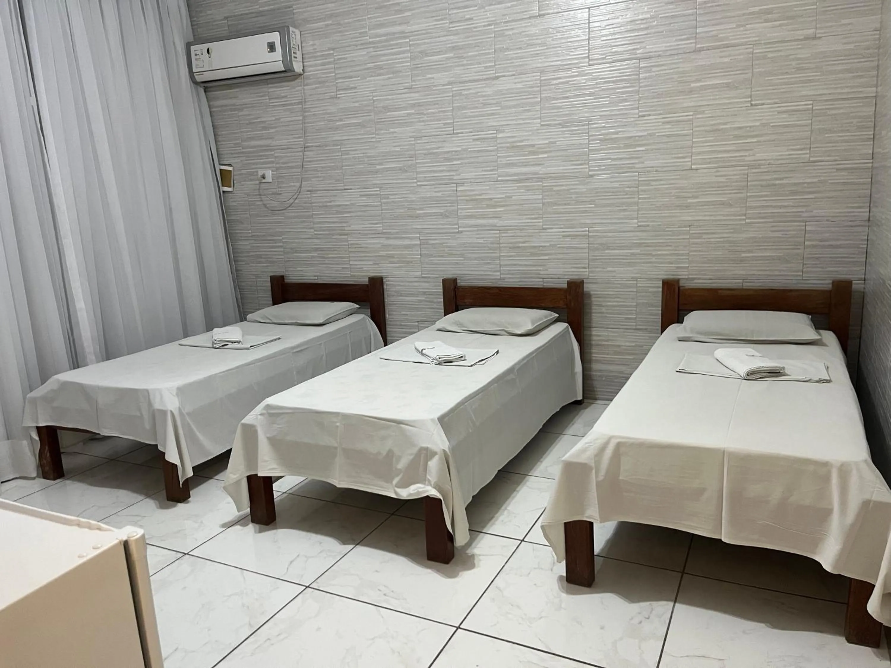 Bed in River Class Hotel