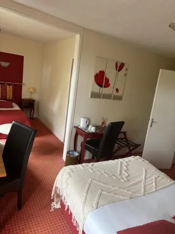 Bed in Logis Hôtel de la Tour