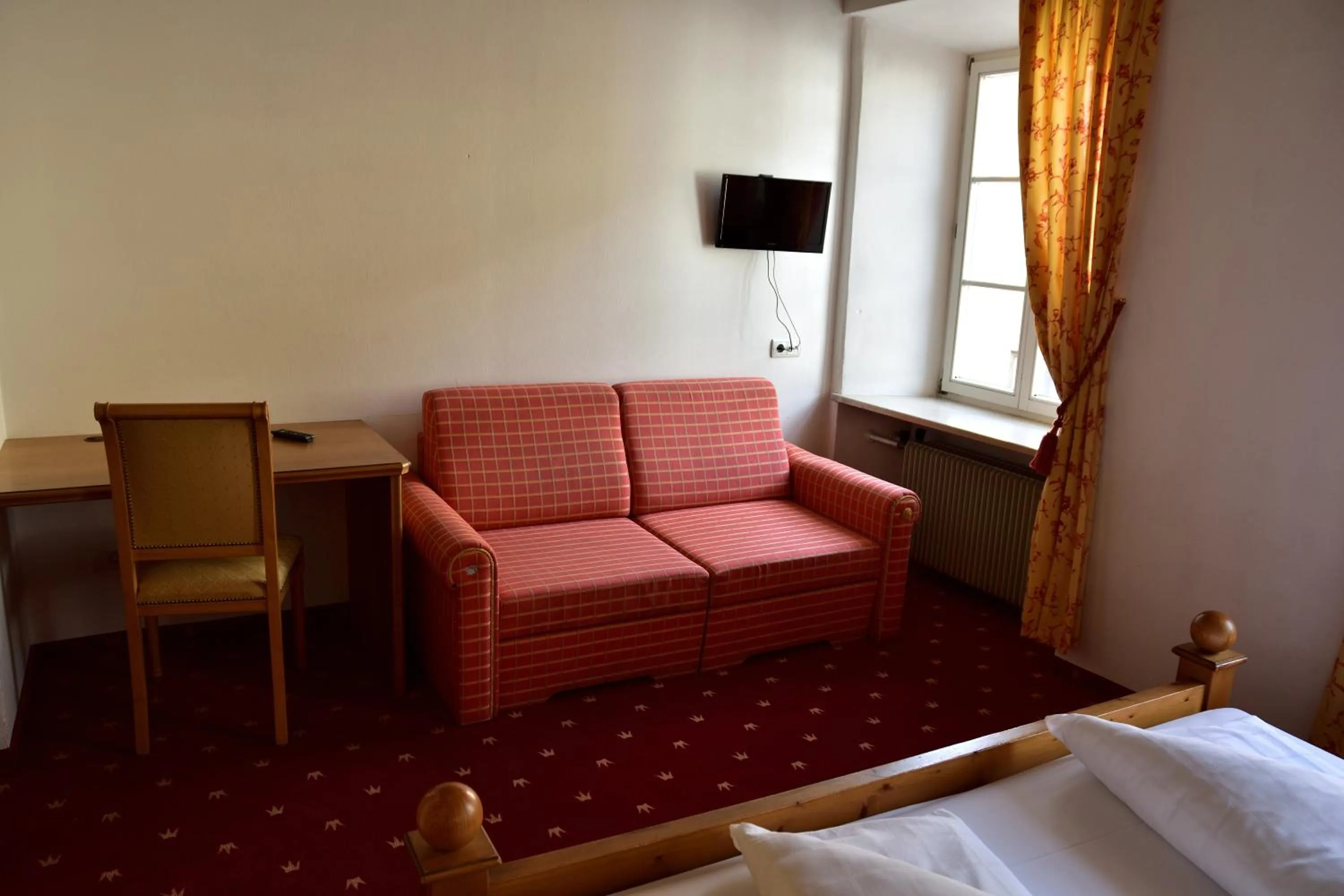 Seating area, Bed in Hotel Krone