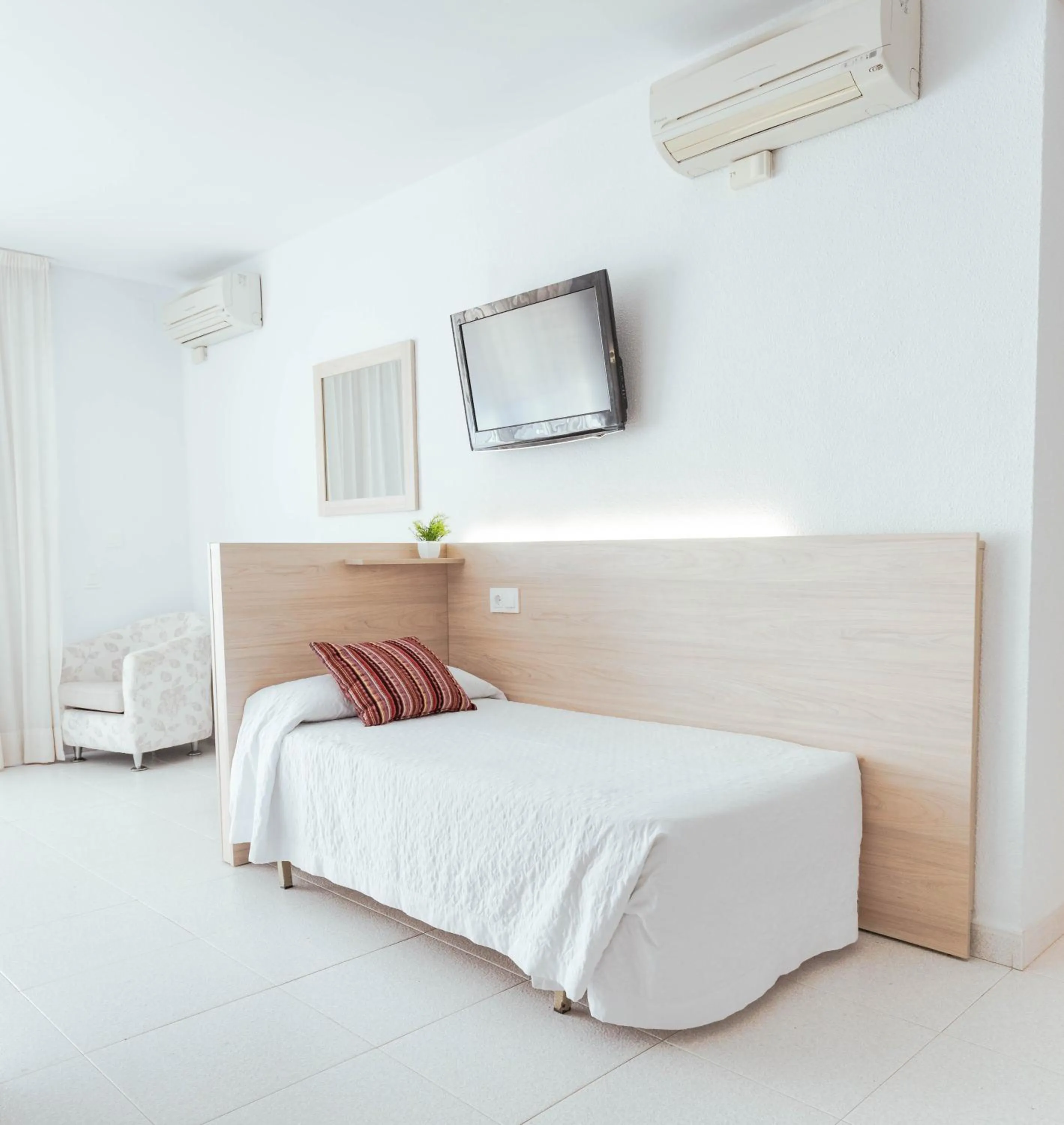 Bed in Hotel S'Agoita