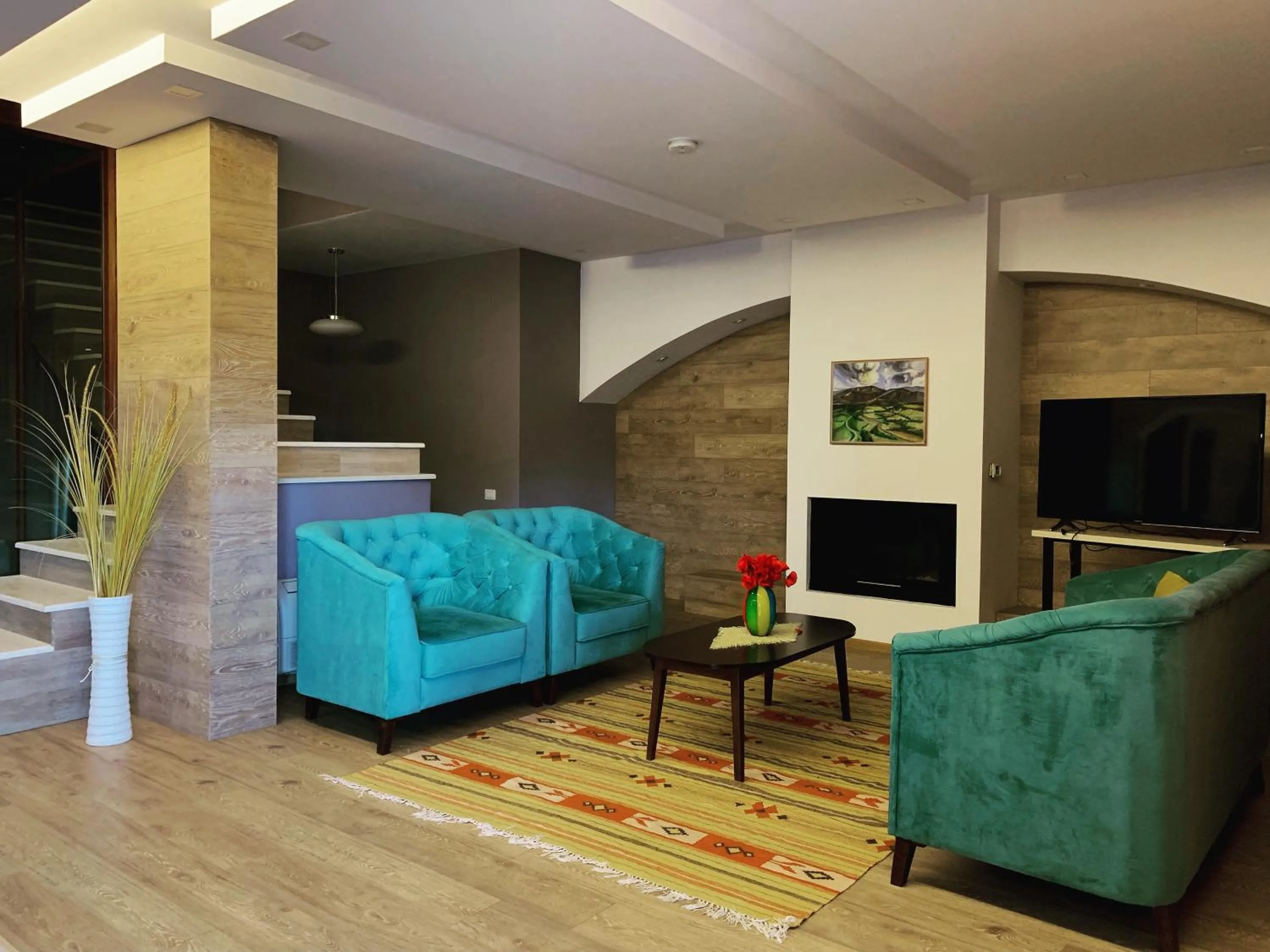 Communal lounge/ TV room in Diamond Beach Residence Hotel