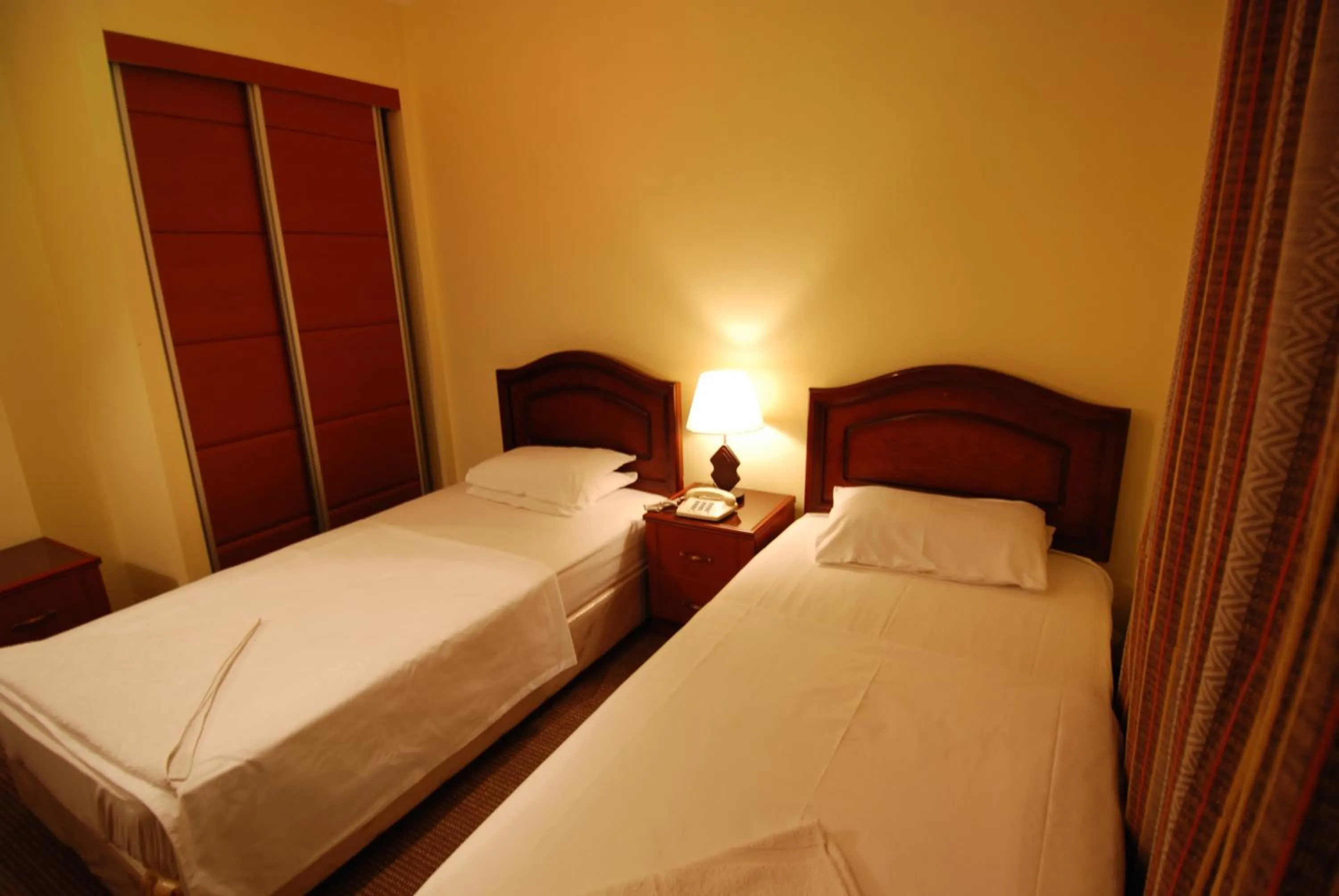 Bed in Al Rashid Hotel