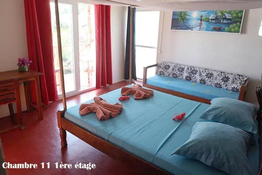 Triple Room with Balcony in Chez Yolande Triple Room with Balcony in Chez Yolande