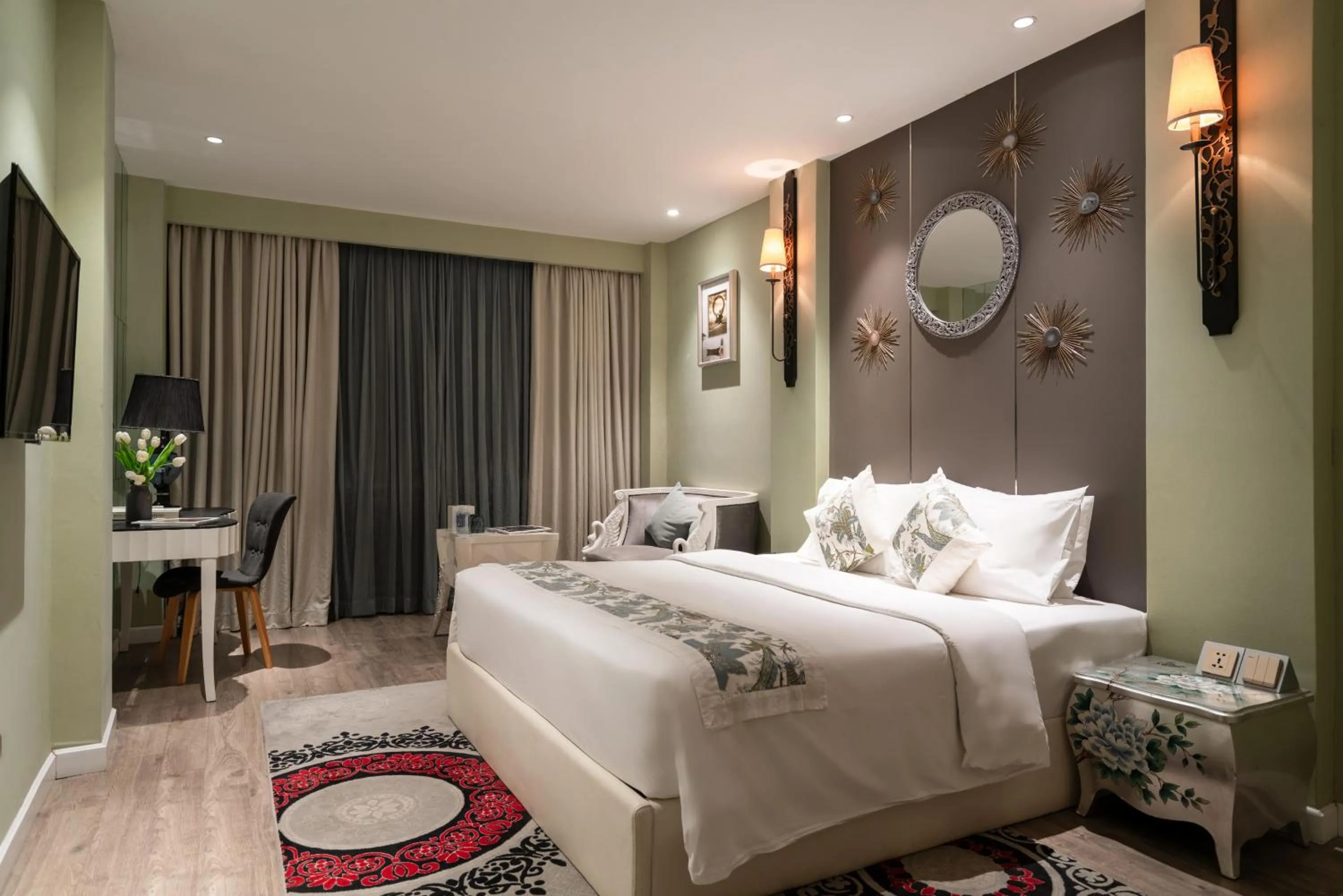 Bed in A&EM Saigon Hotel