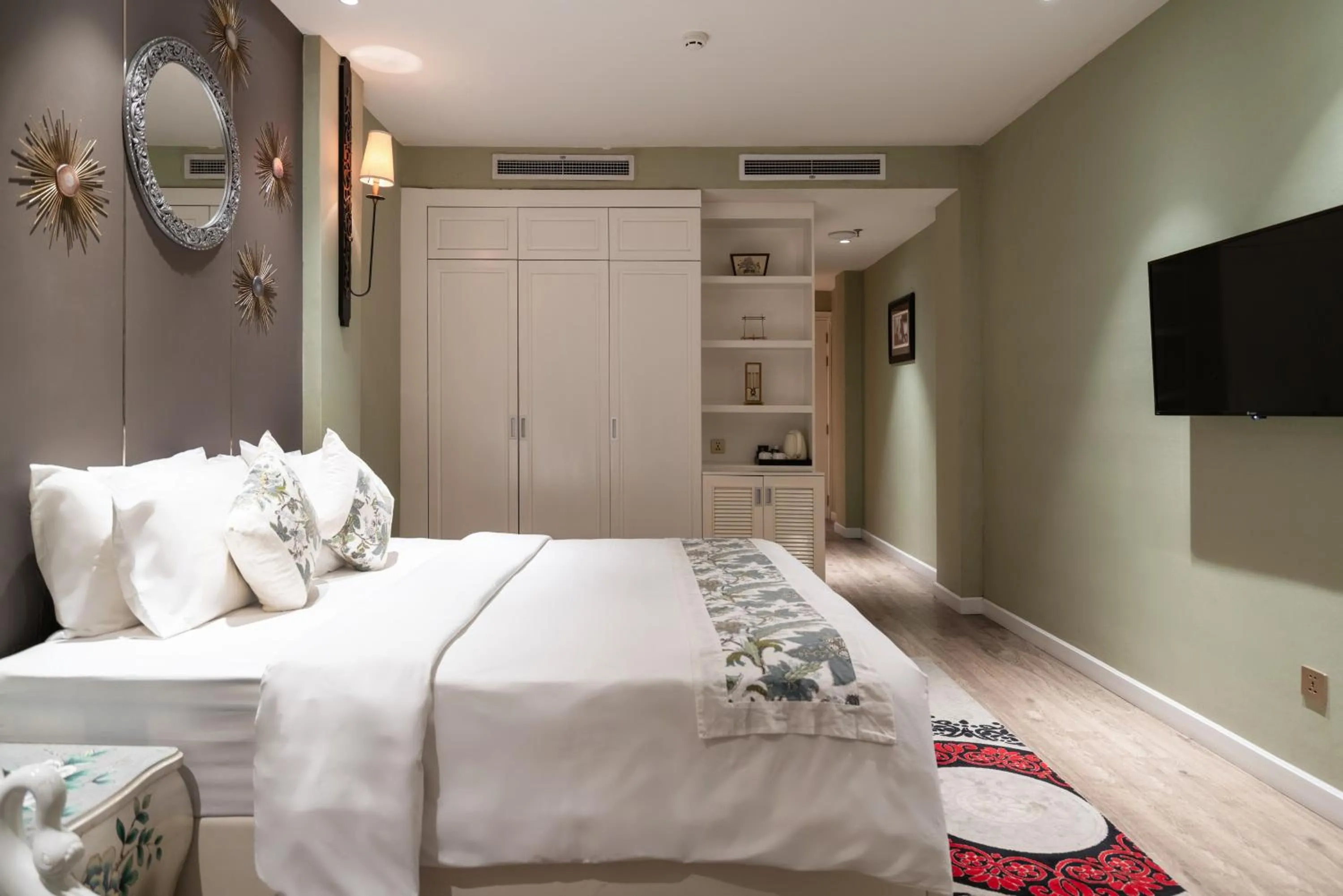 Bed in A&EM Saigon Hotel