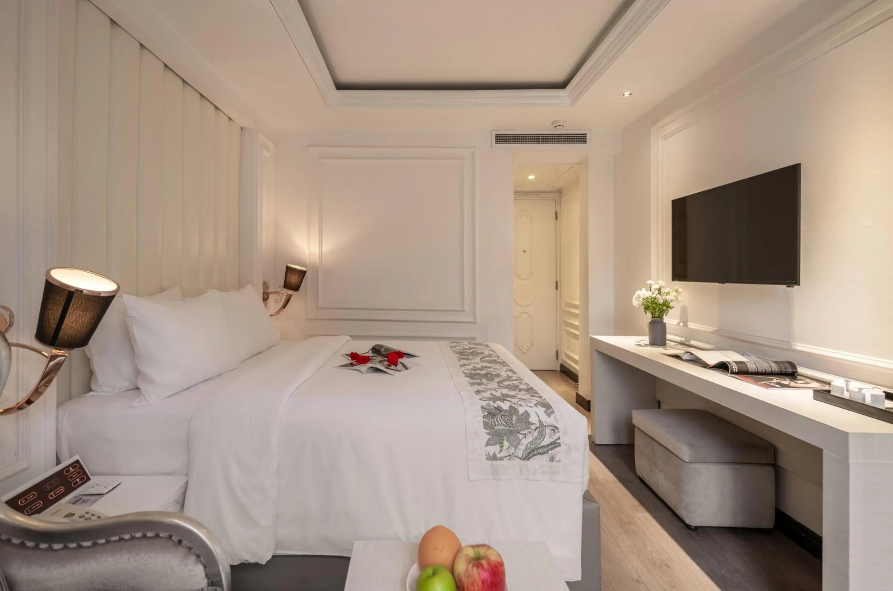 Bed in A&EM Saigon Hotel