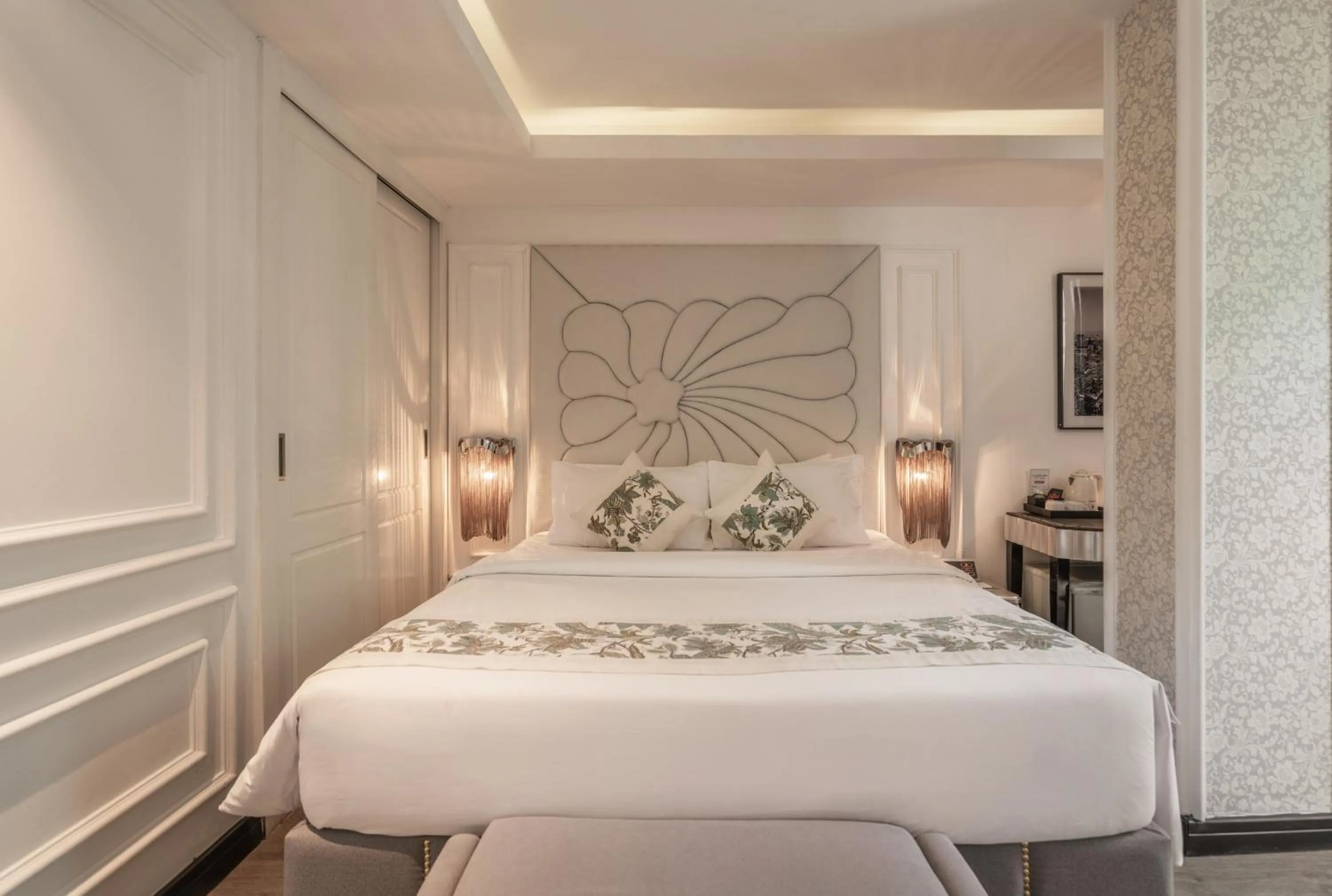 Bed in A&EM Saigon Hotel