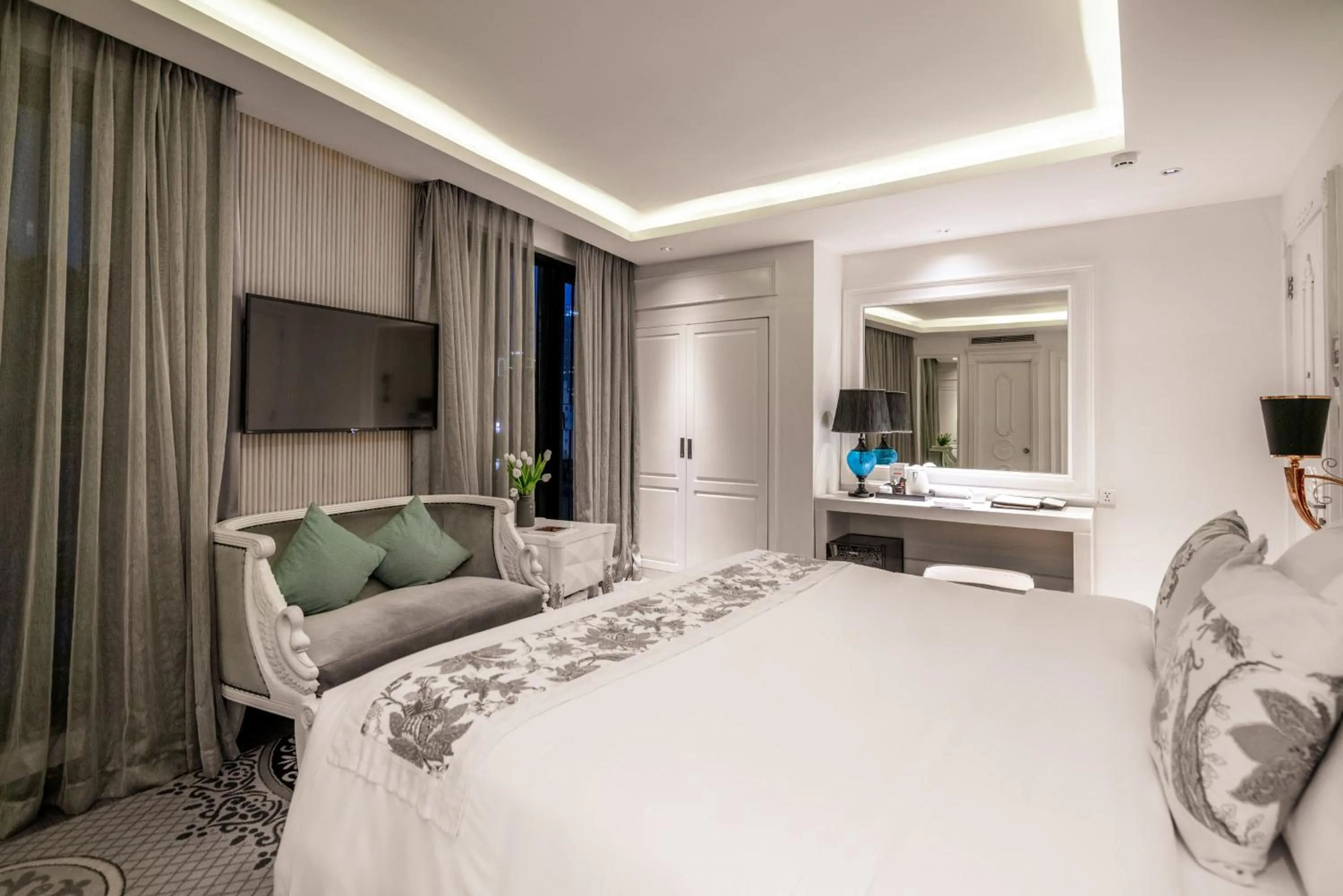 Bed in A&EM Saigon Hotel