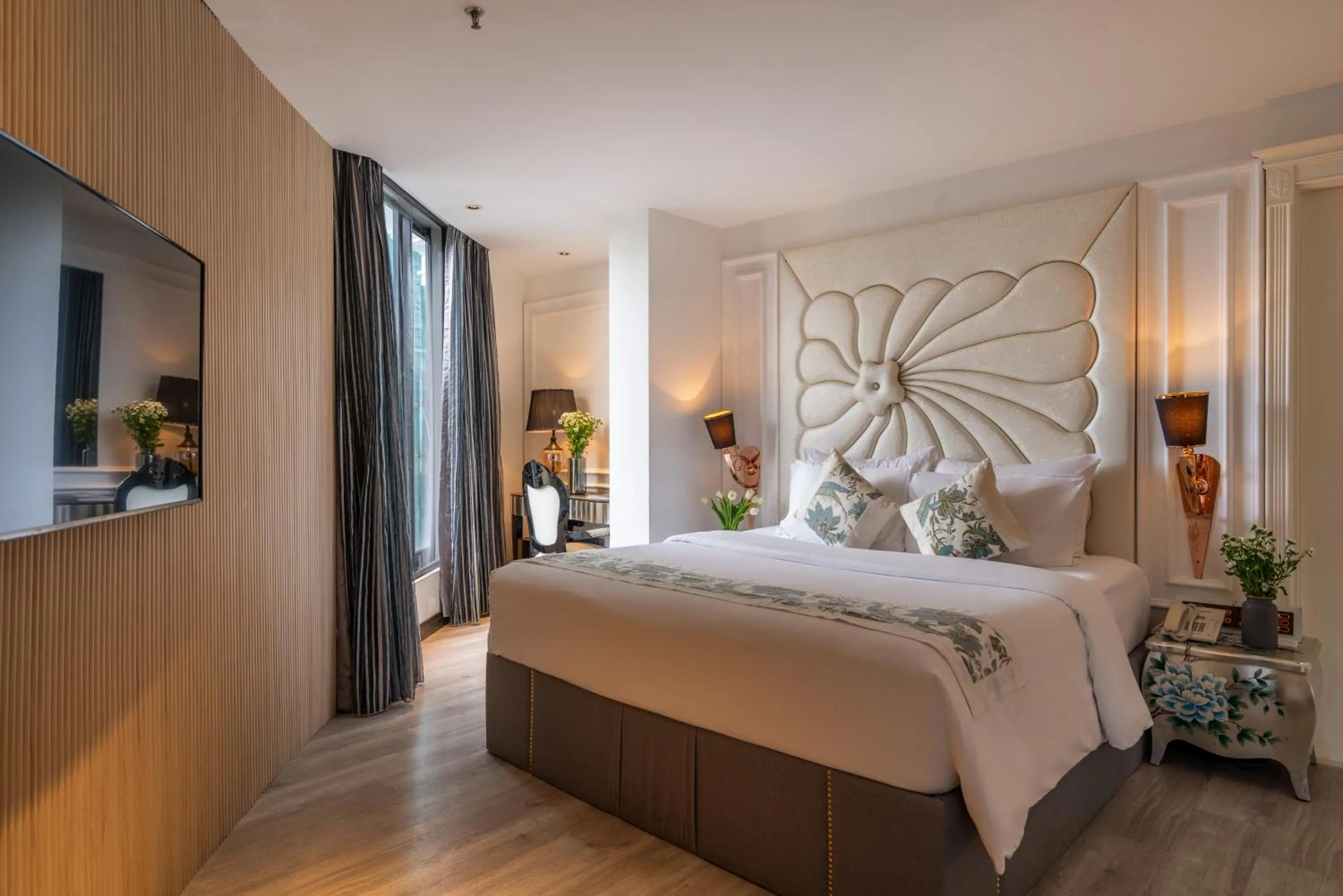 Bed in A&EM Saigon Hotel