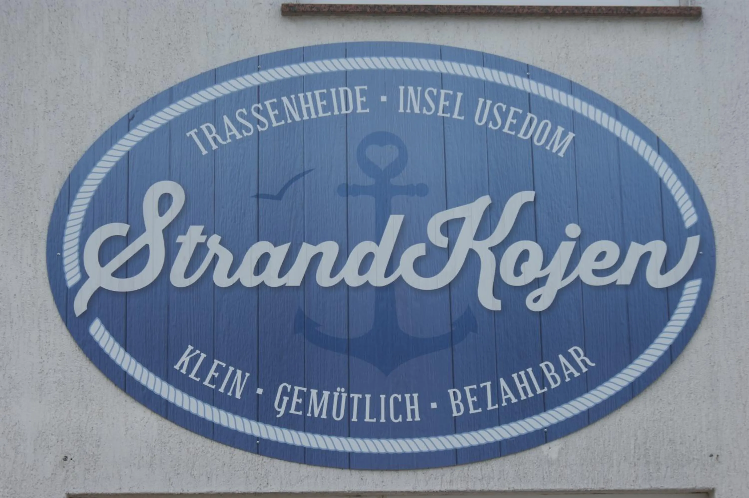 Property logo or sign in Strandkojen