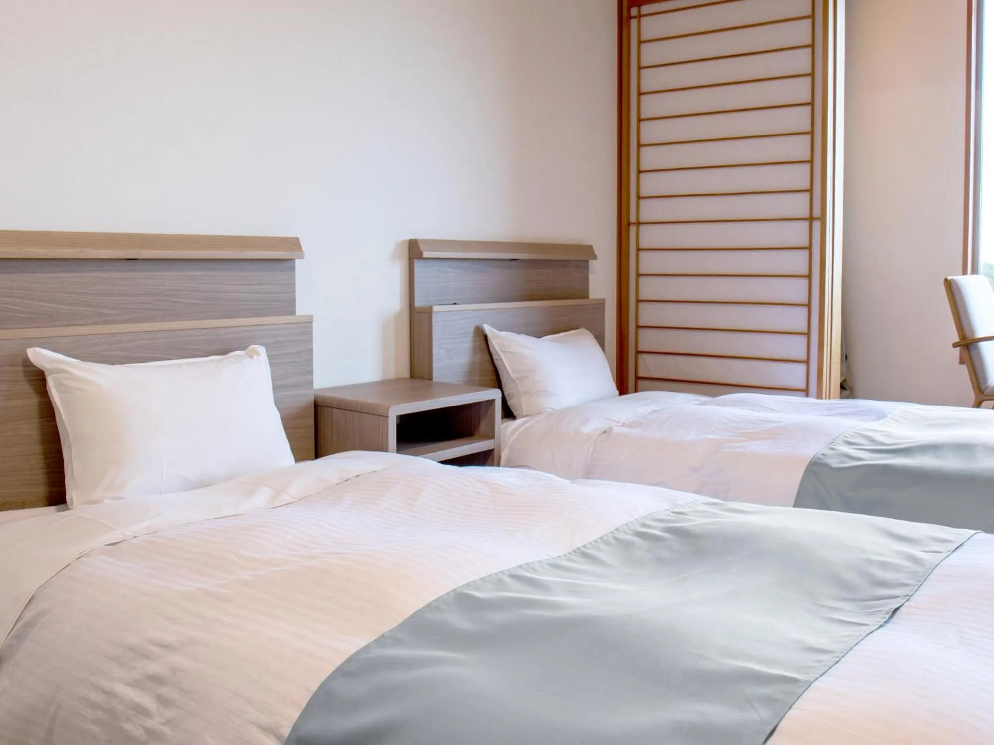 Bed in KAMENOI HOTEL Aomori Makado