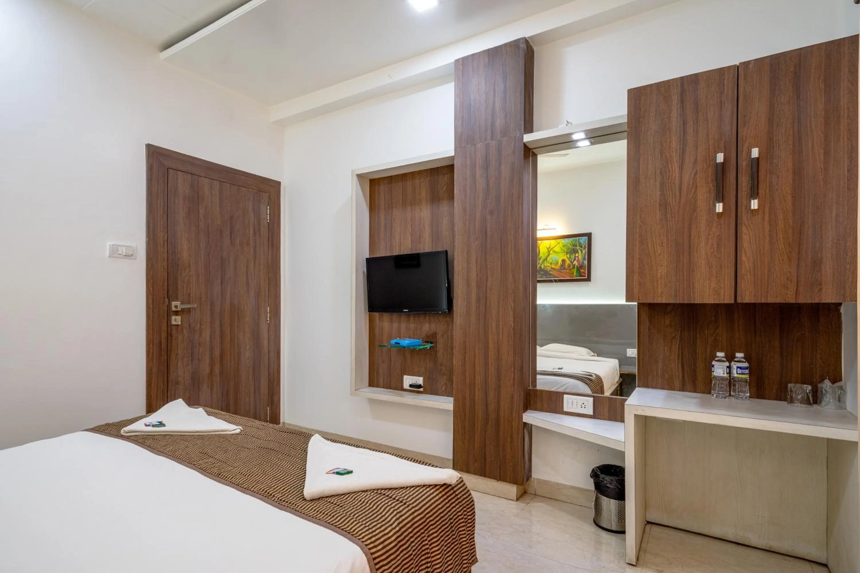 Bed in Hotel Darshan Executive