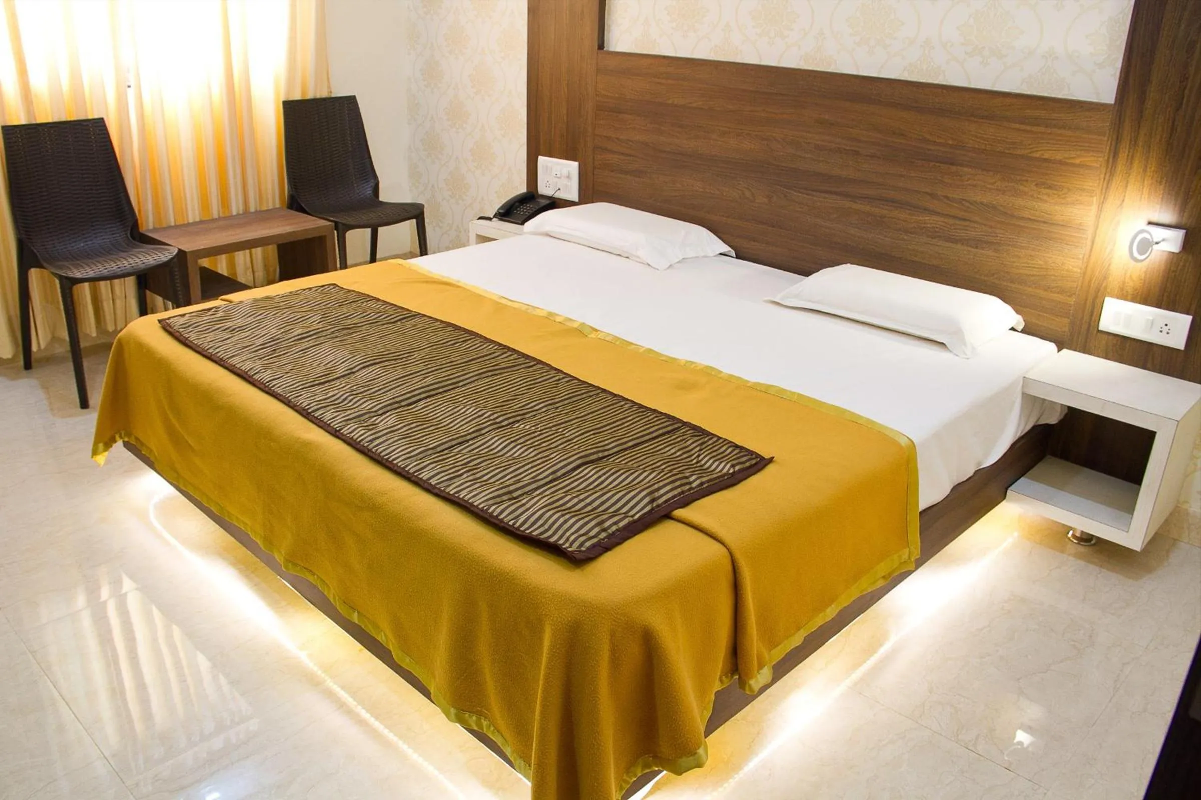 Bed in Hotel Darshan Executive