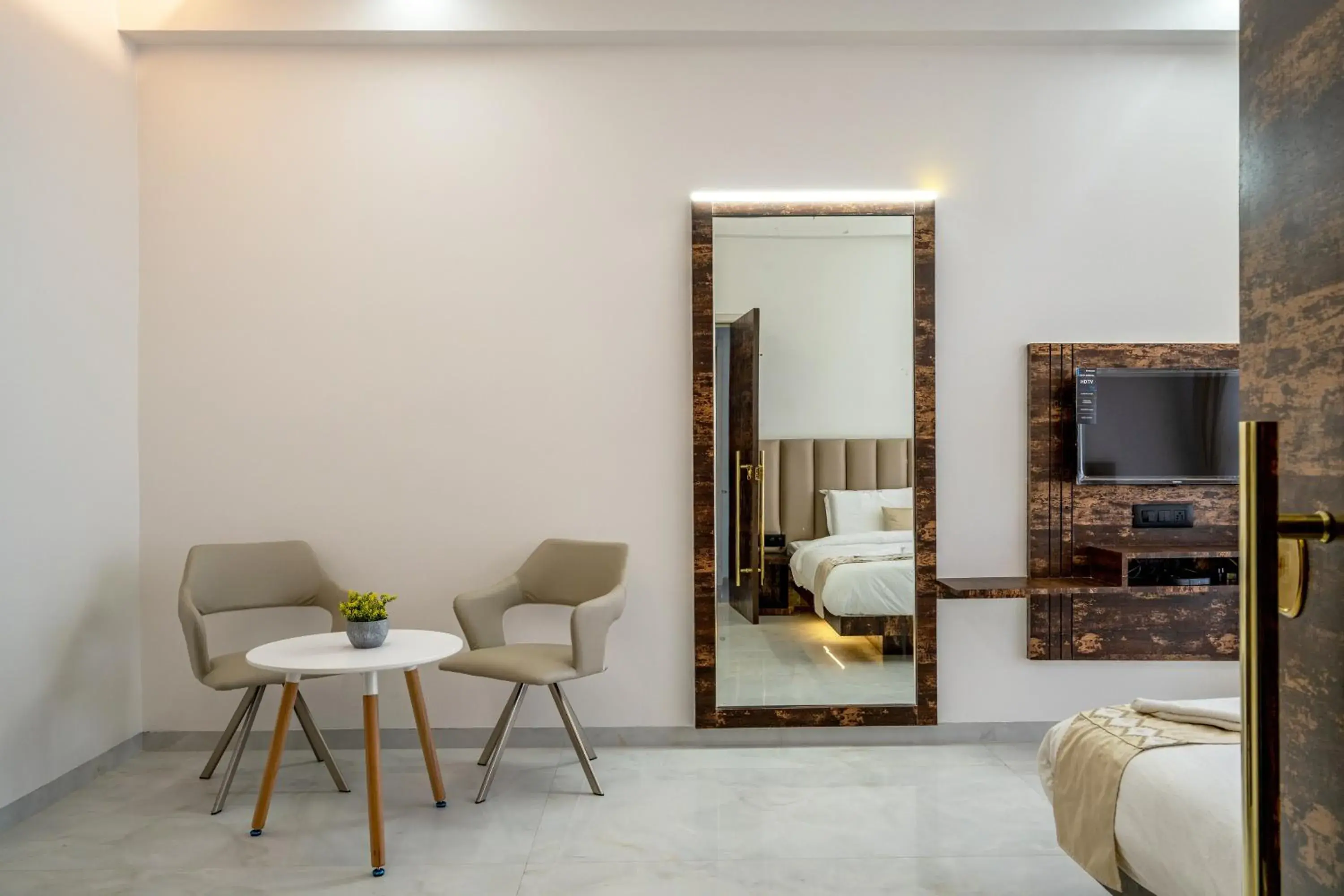 Seating area, Bed in Hotel Darshan Executive Seating area, Bed in Hotel Darshan Executive