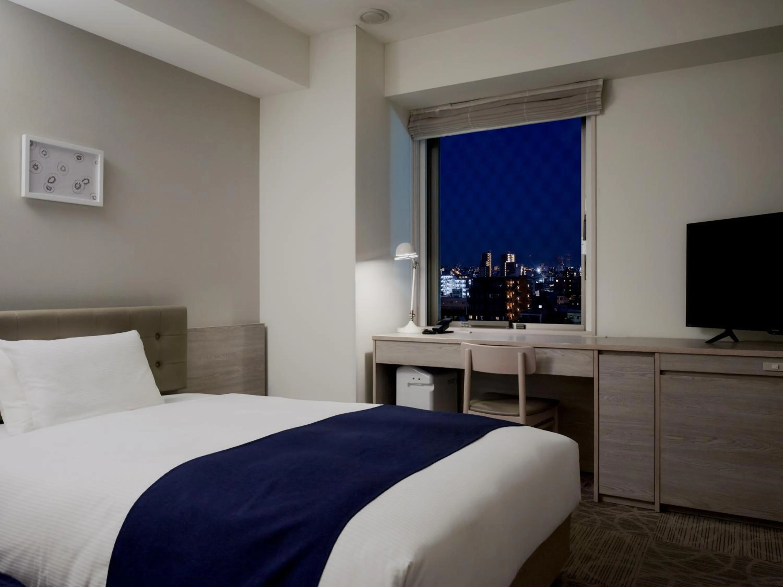 Bed in hotel MONday Haneda Airport