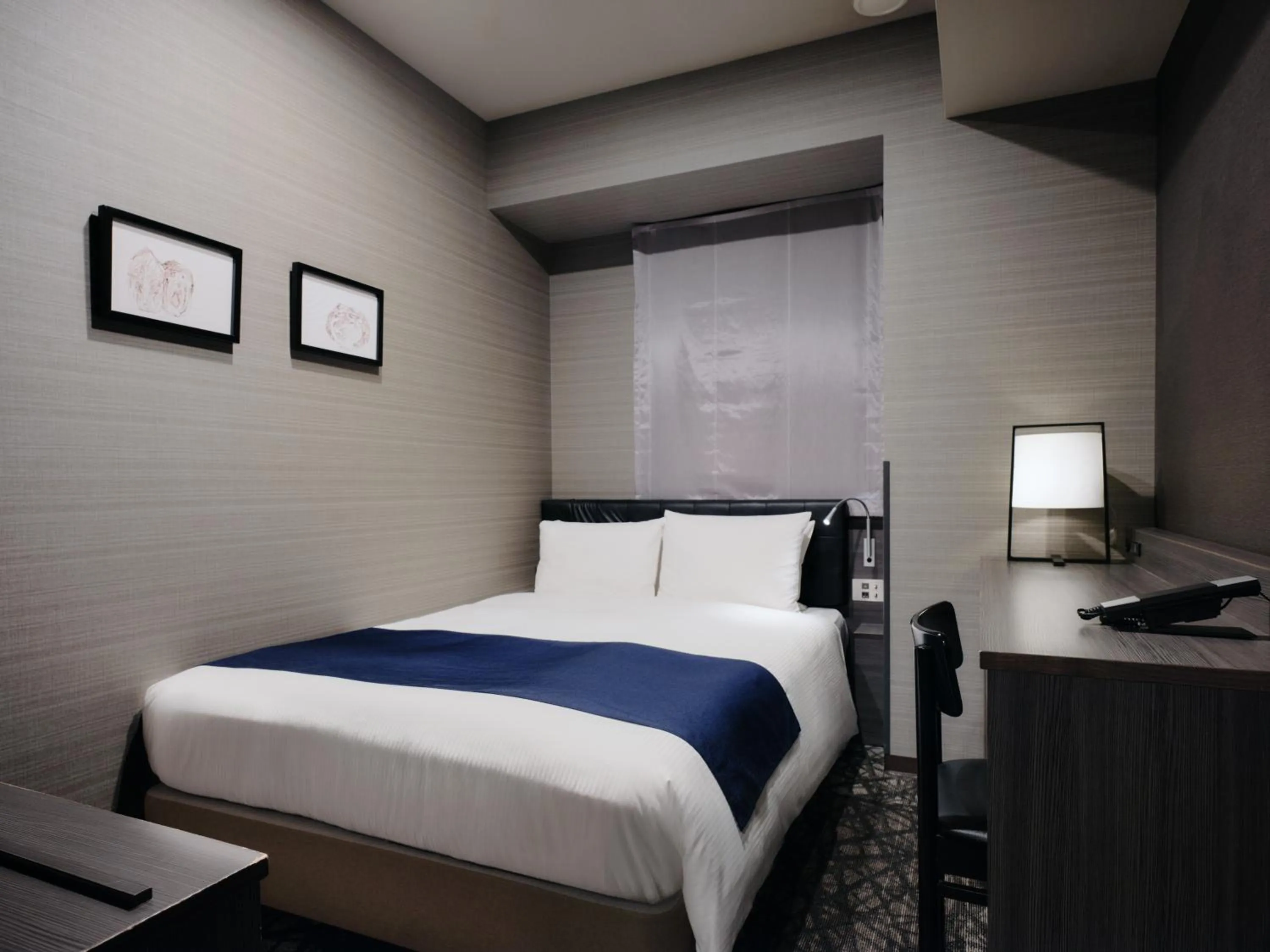 Bed in hotel MONday Haneda Airport