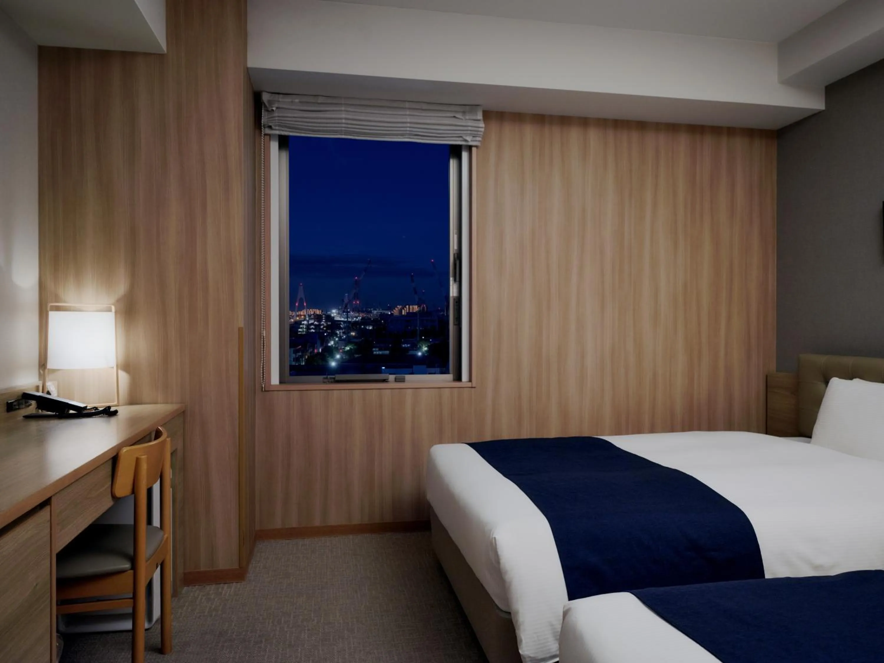 Bed in hotel MONday Haneda Airport