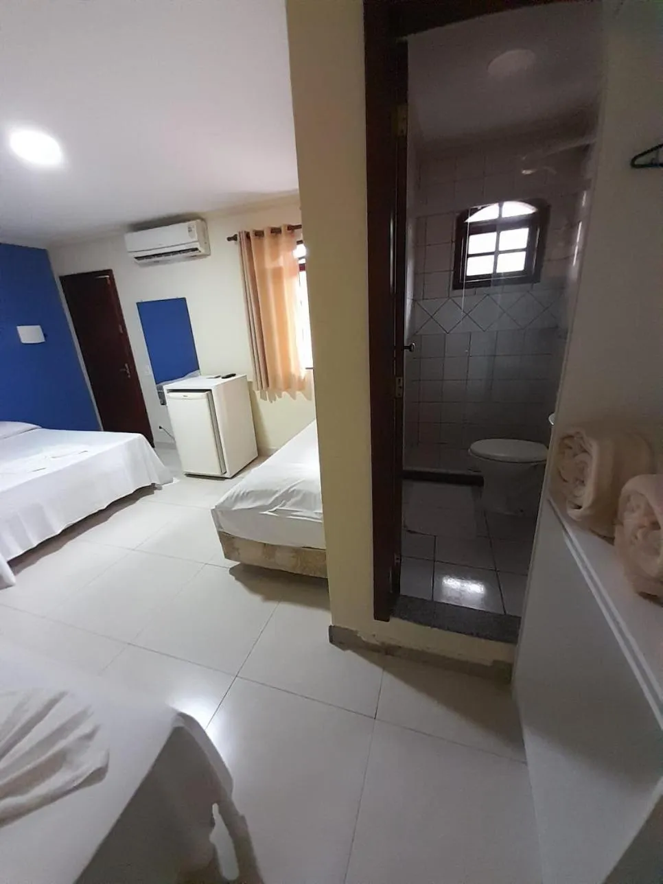 Bed in Pousada Dom Fernandes