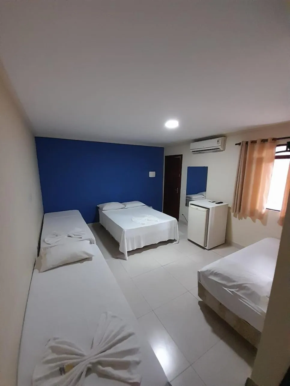 Bed in Pousada Dom Fernandes