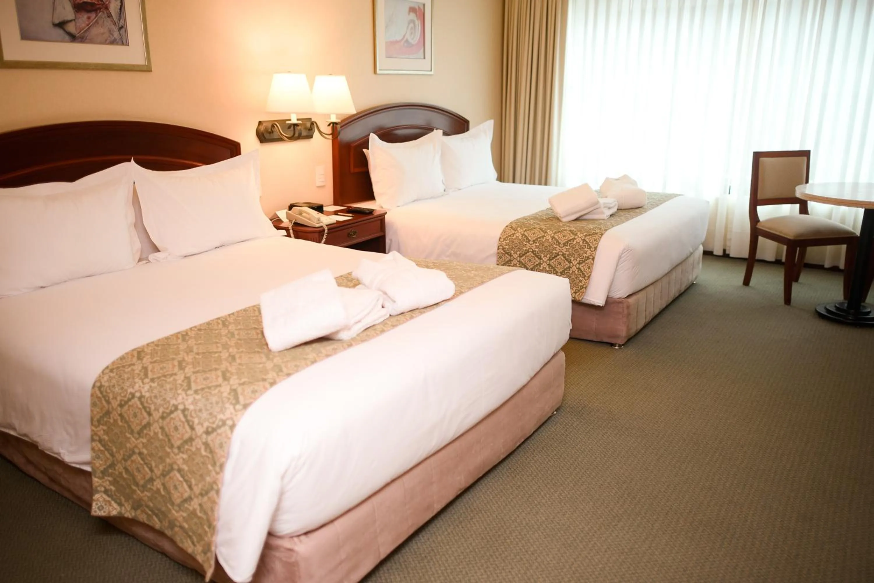 Bed in Los Tallanes Hotel & Suites