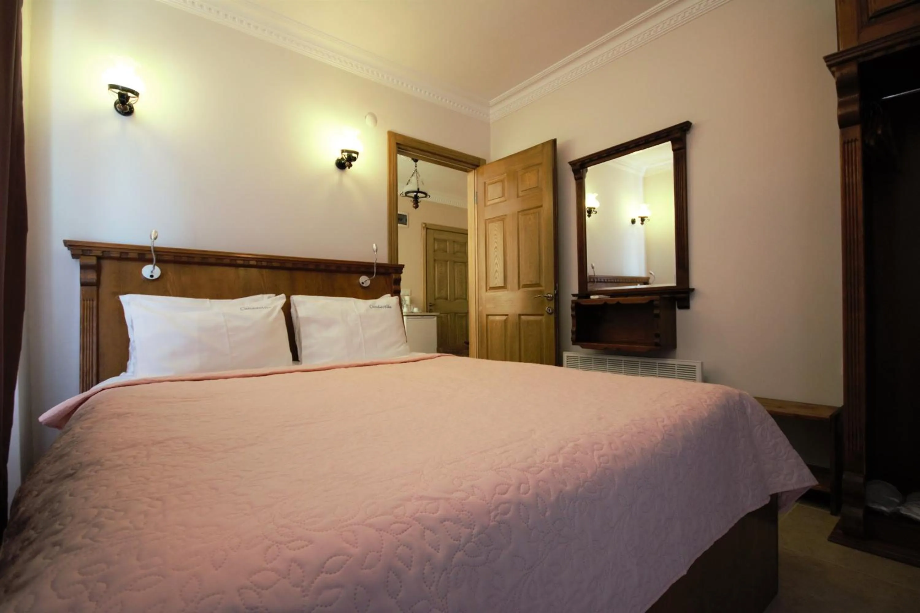 Bed in Cundavilla Hotel & Suites