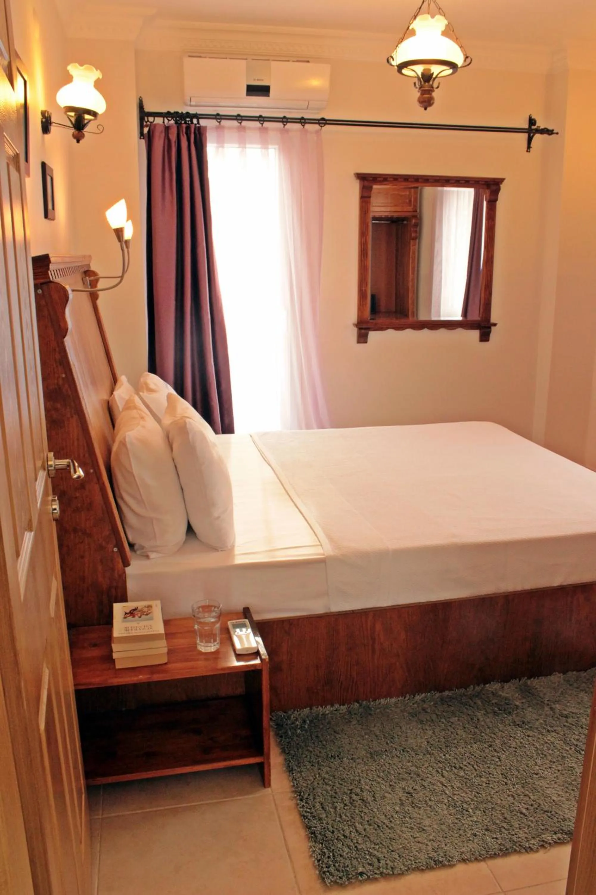 Bed in Cundavilla Hotel & Suites
