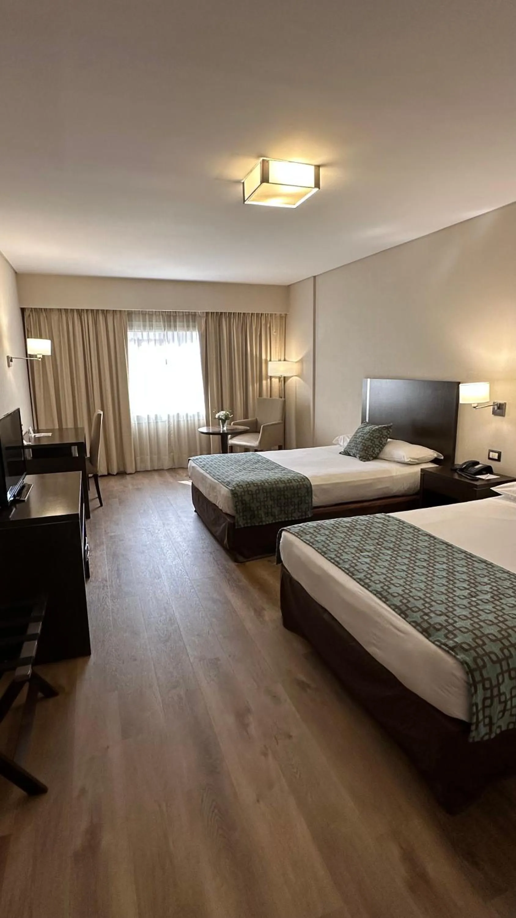 Bed in Land Plaza Hotel