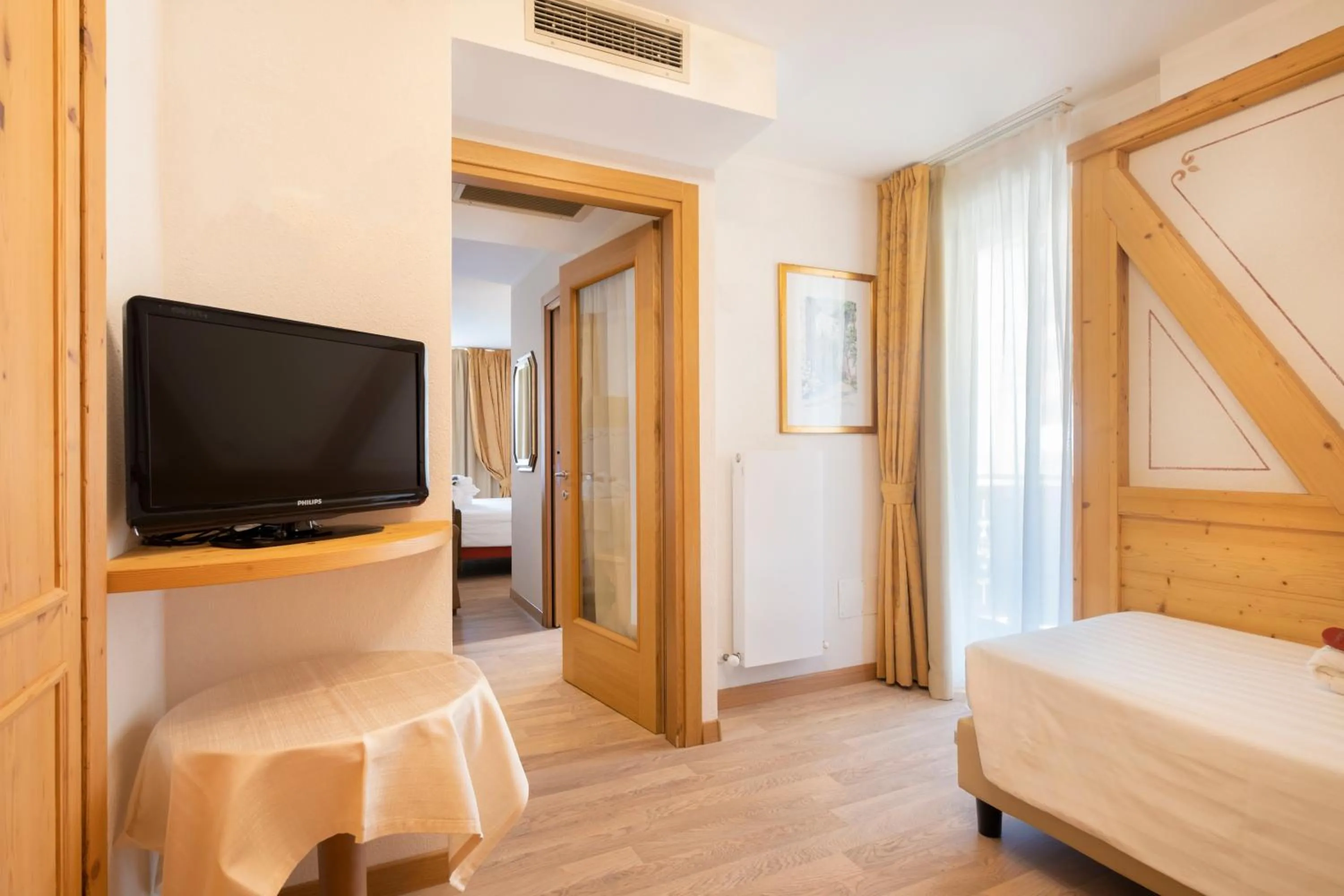 Bed in Piz Galin Grand Hotel Family & Wellness
