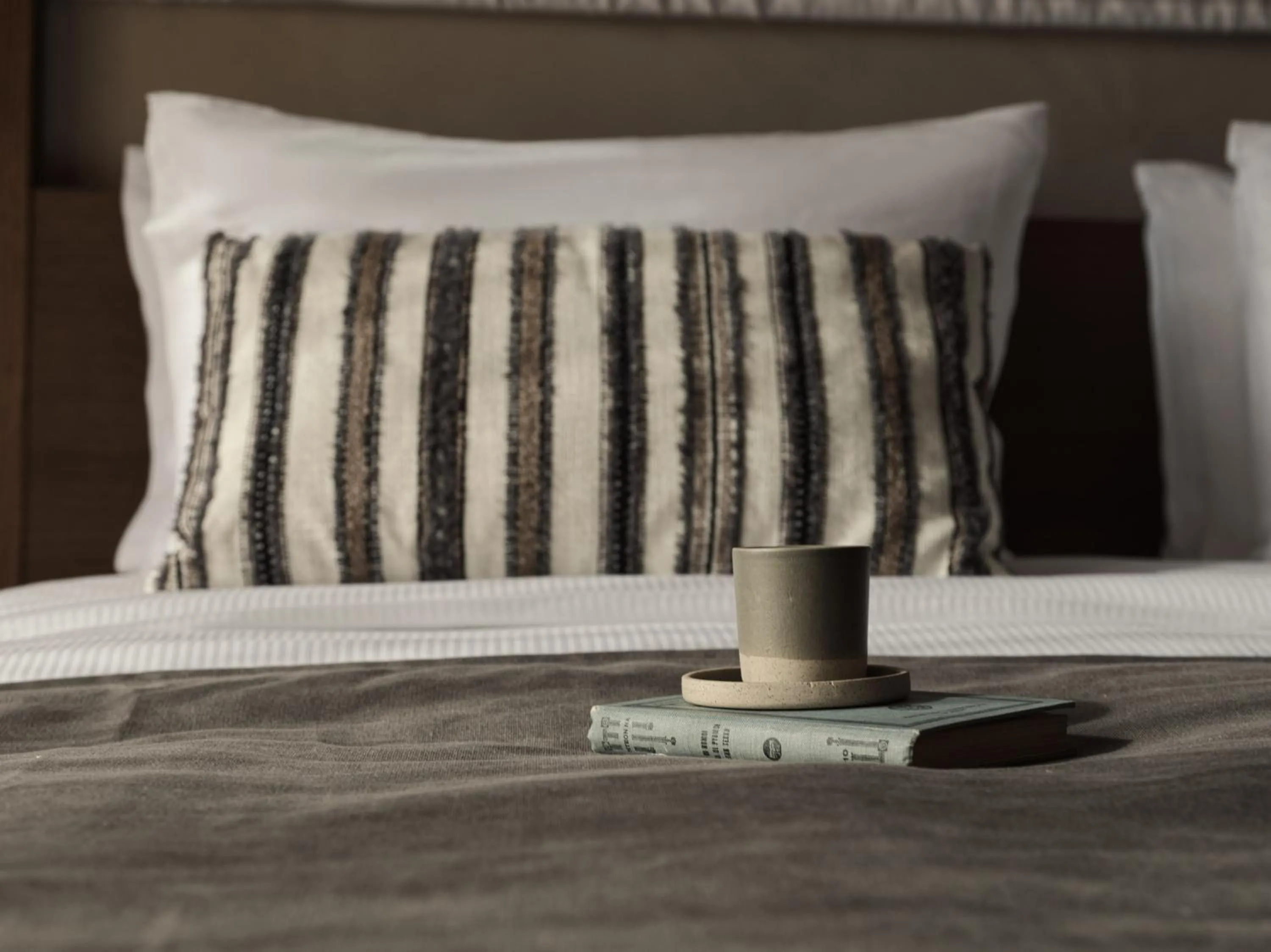 Bed in Lindian Village, Curio Collection by Hilton