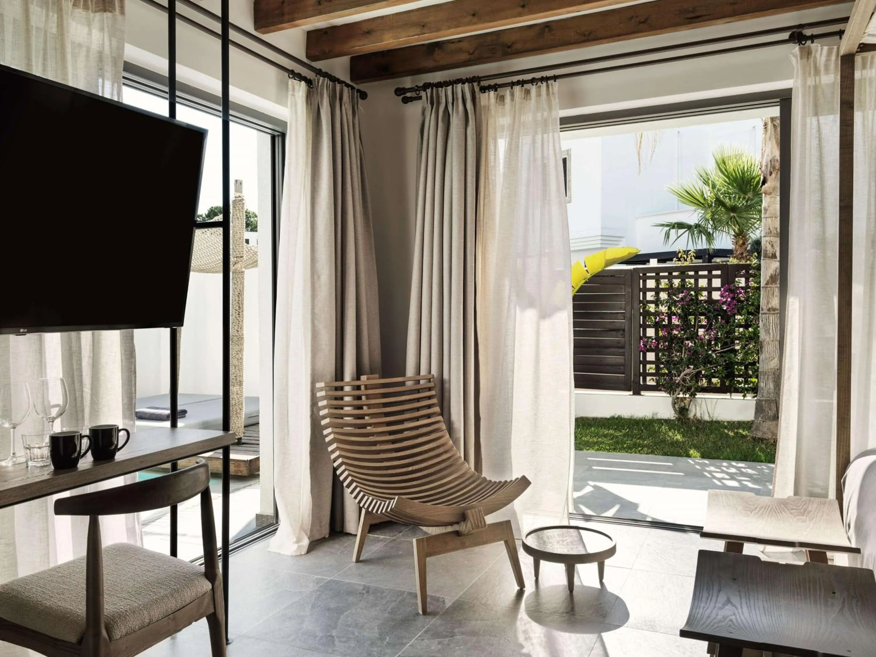 Living room in Lindian Village, Curio Collection by Hilton