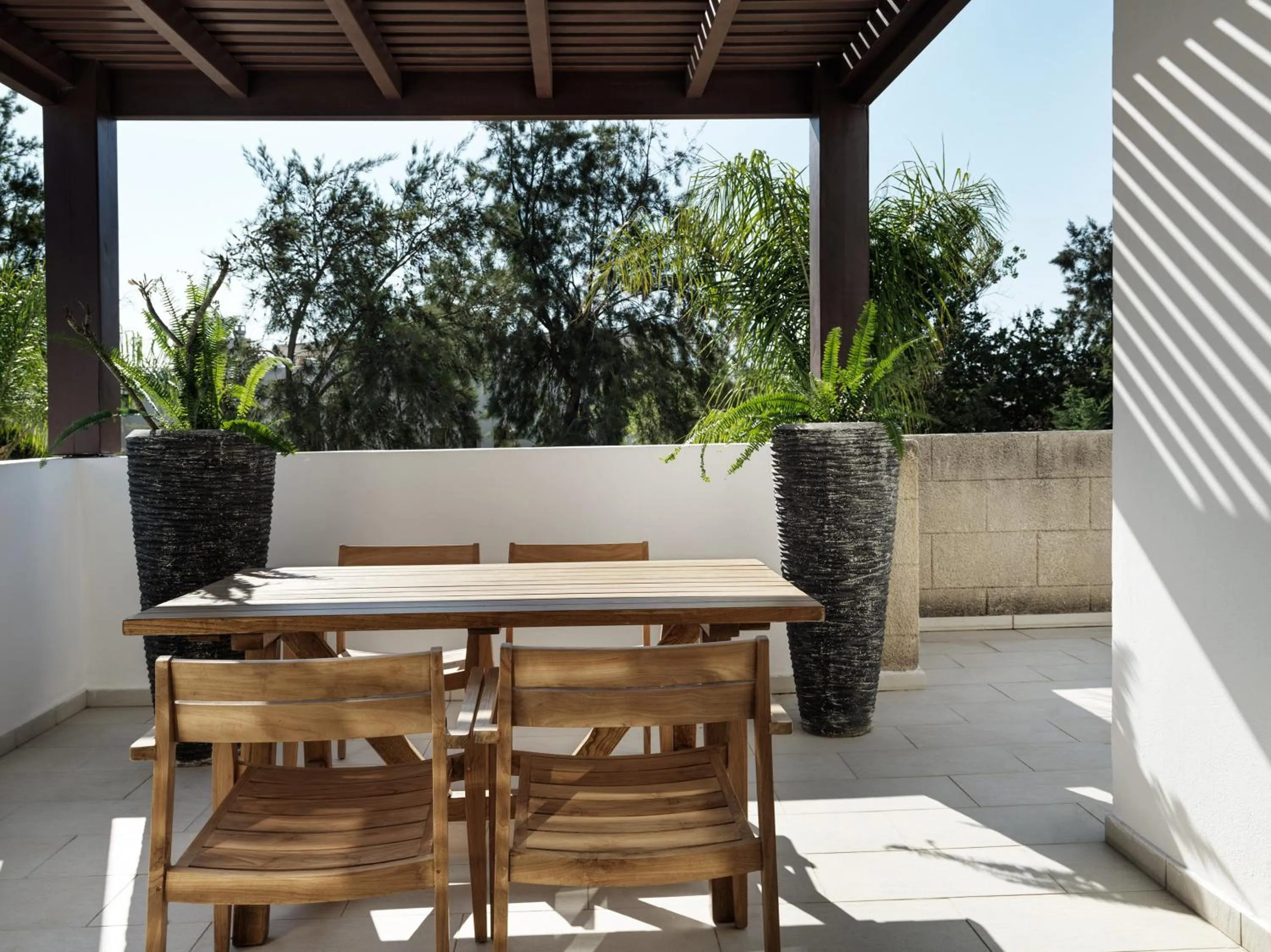 Patio in Lindian Village, Curio Collection by Hilton