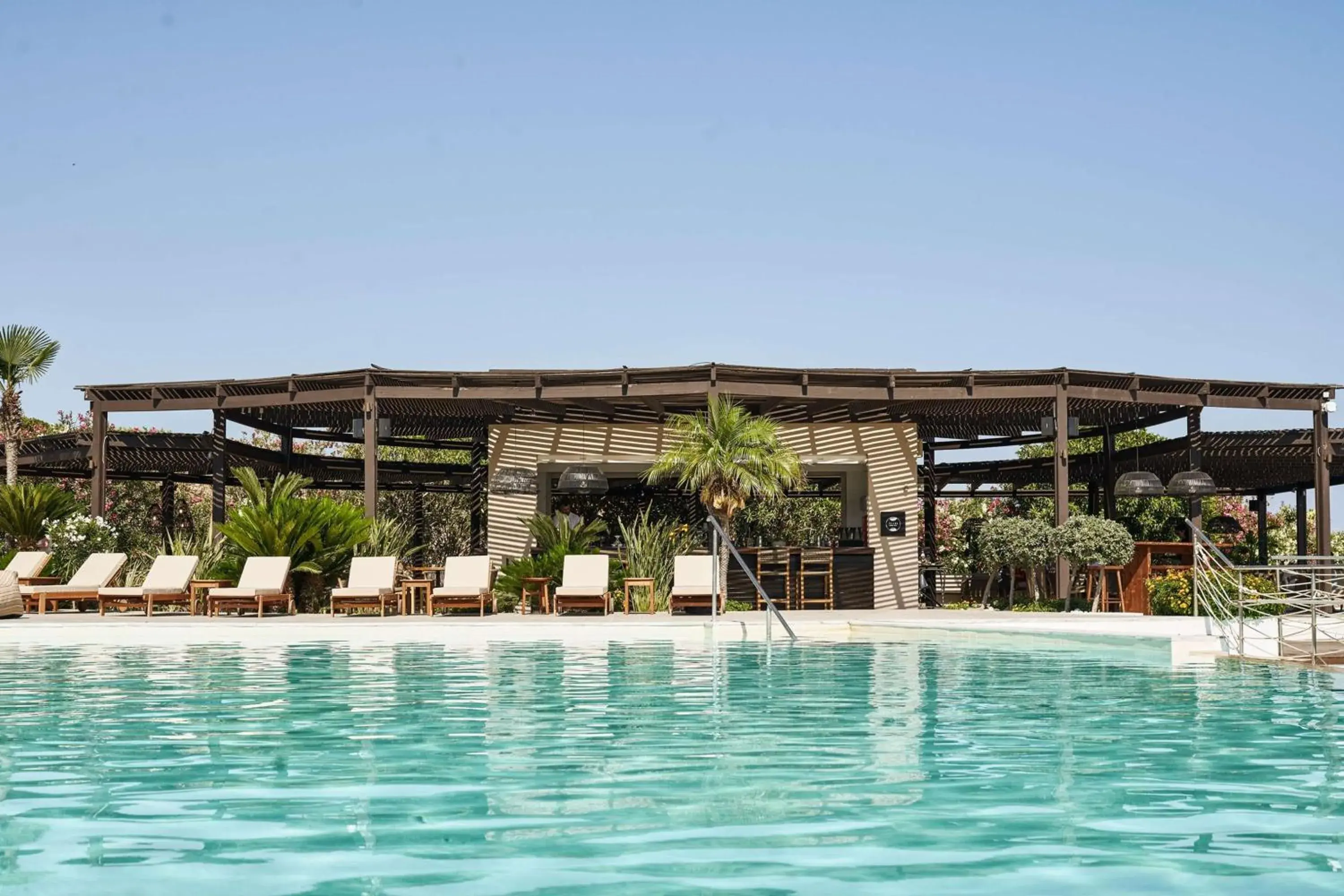 Pool view in Lindian Village, Curio Collection by Hilton Pool view in Lindian Village, Curio Collection by Hilton