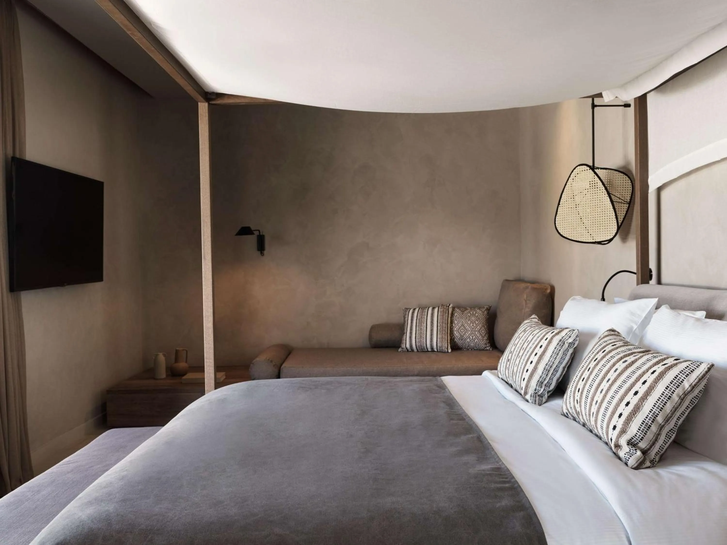 Bed in Lindian Village, Curio Collection by Hilton