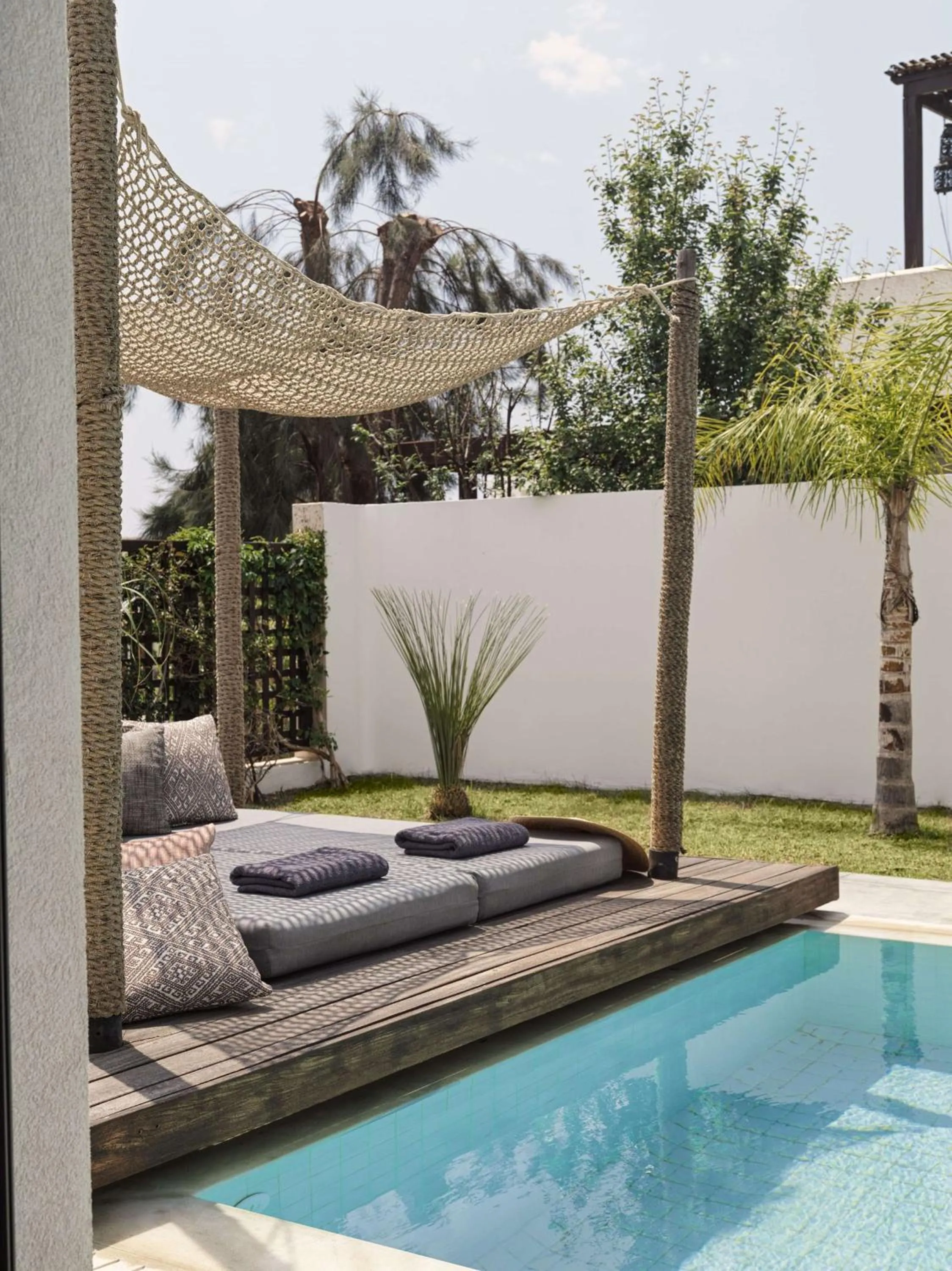 Living room in Lindian Village, Curio Collection by Hilton