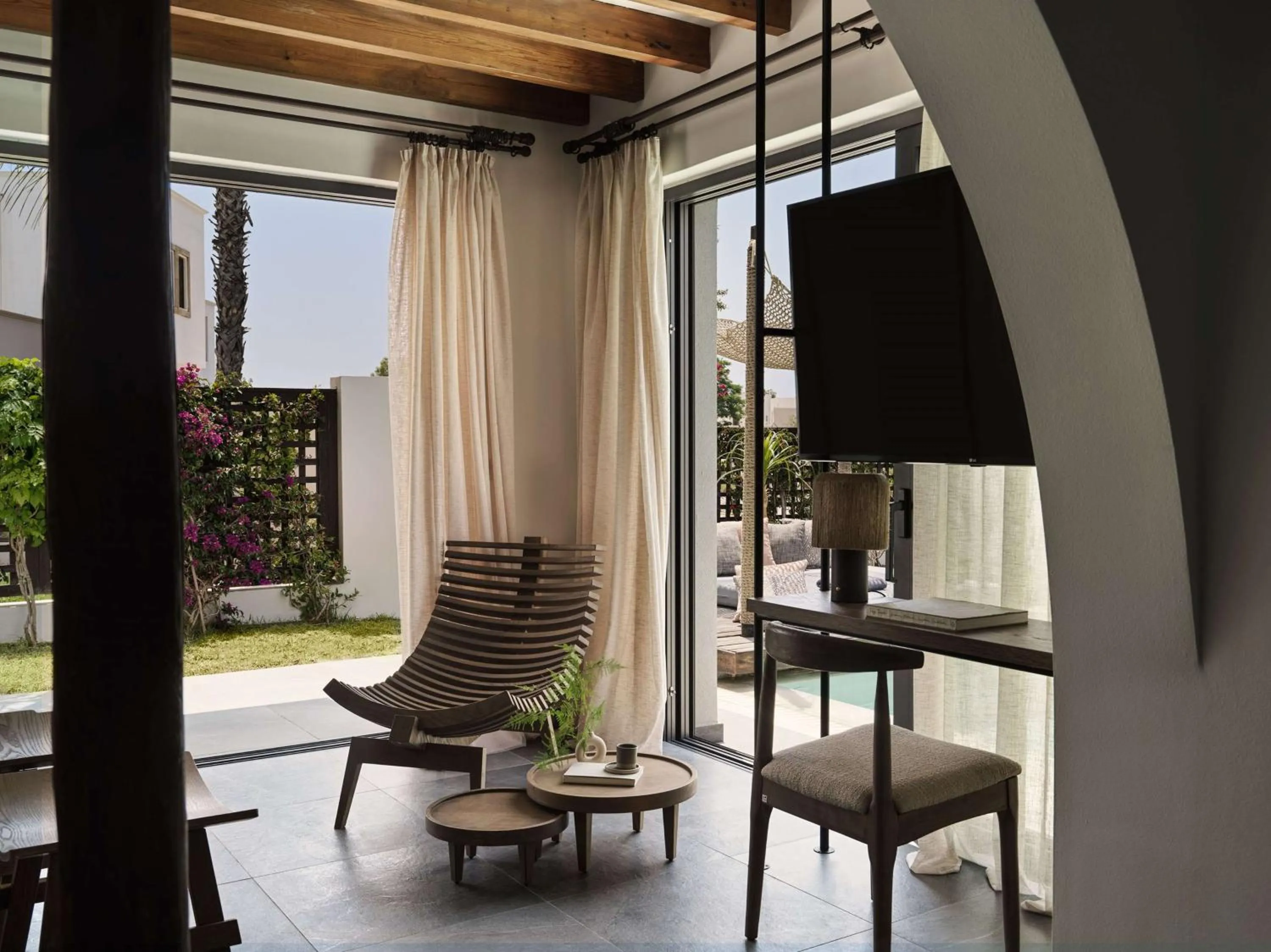 Living room in Lindian Village, Curio Collection by Hilton