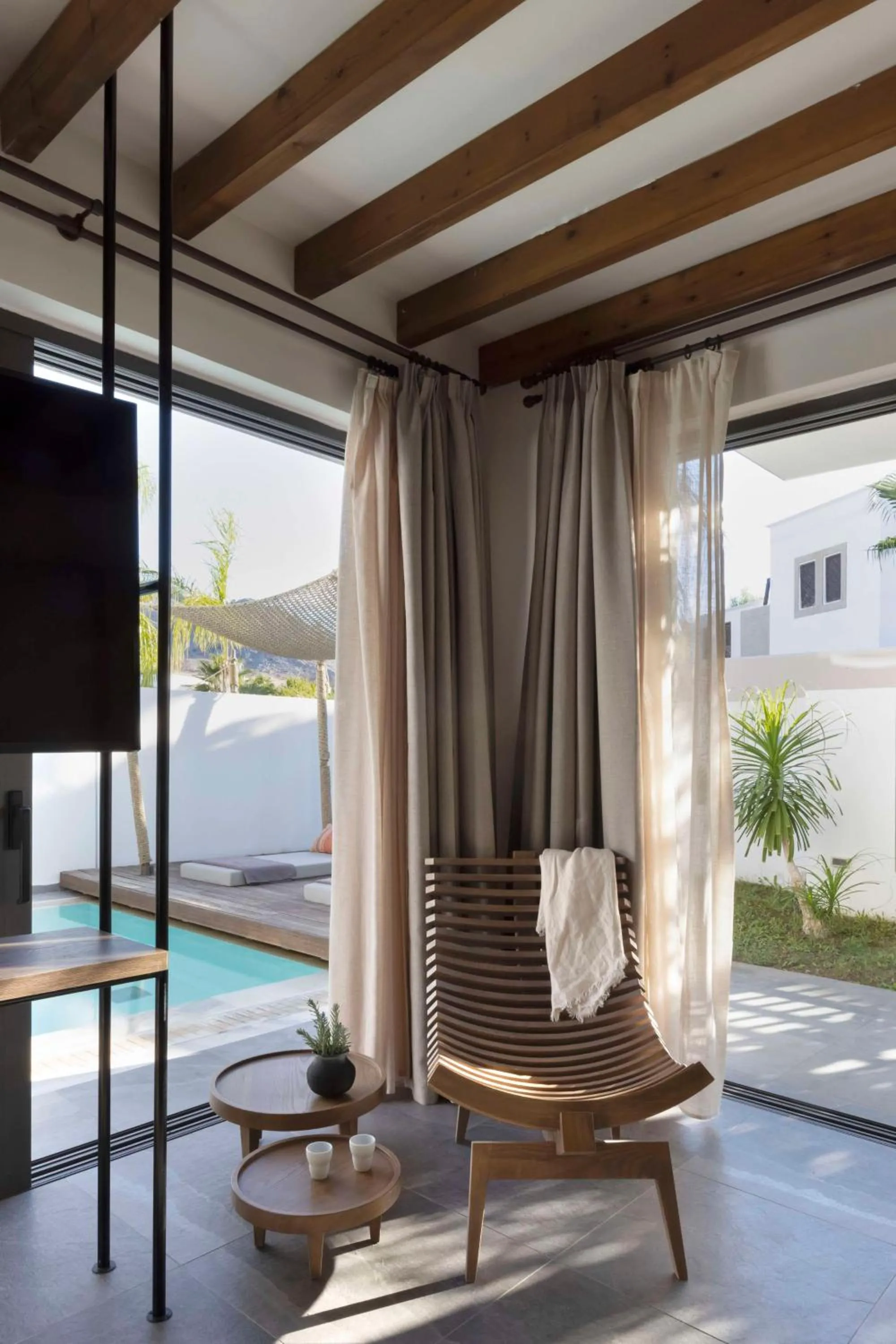 Living room in Lindian Village, Curio Collection by Hilton