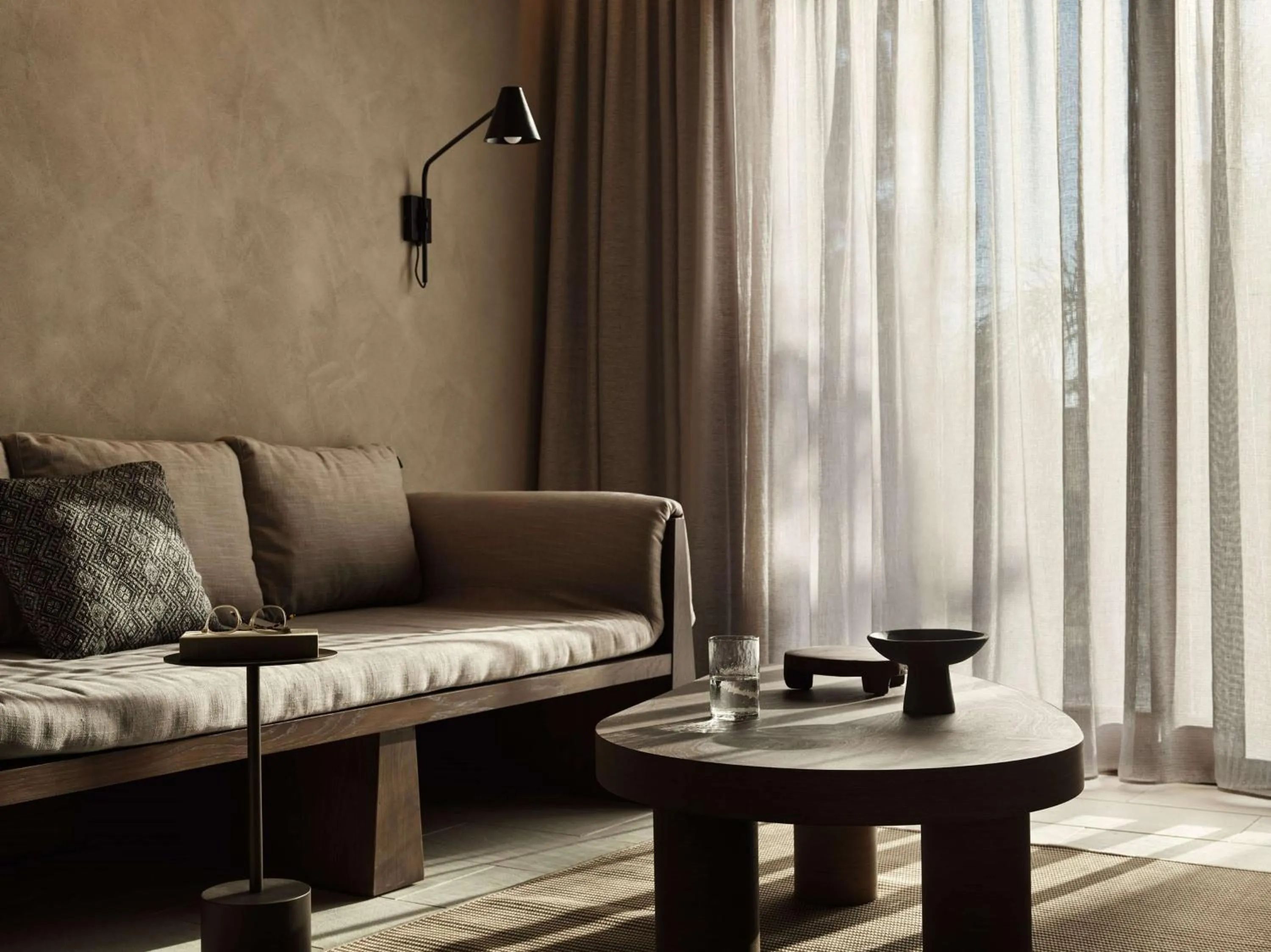 Living room in Lindian Village, Curio Collection by Hilton