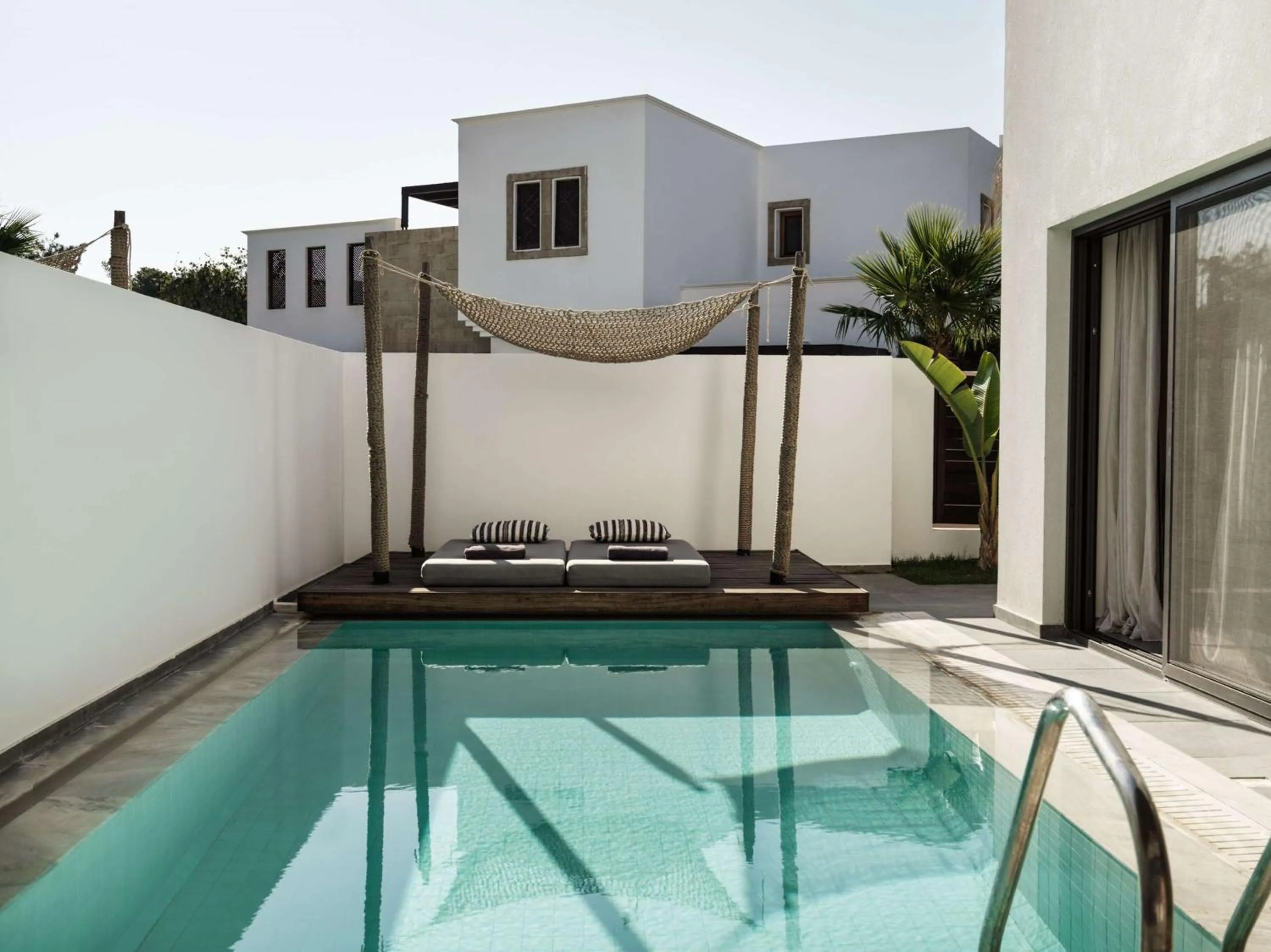 Living room in Lindian Village, Curio Collection by Hilton