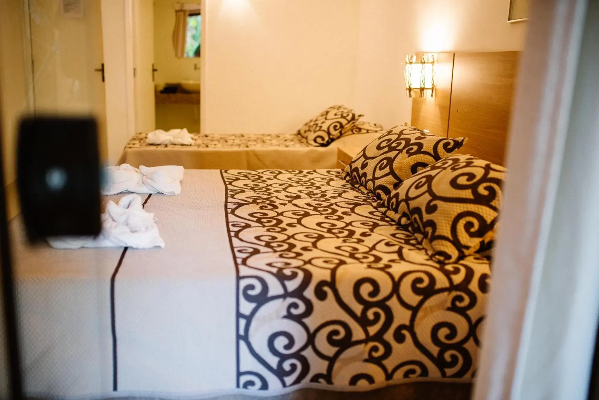 Bed in Hotel La Brise Bed in Hotel La Brise