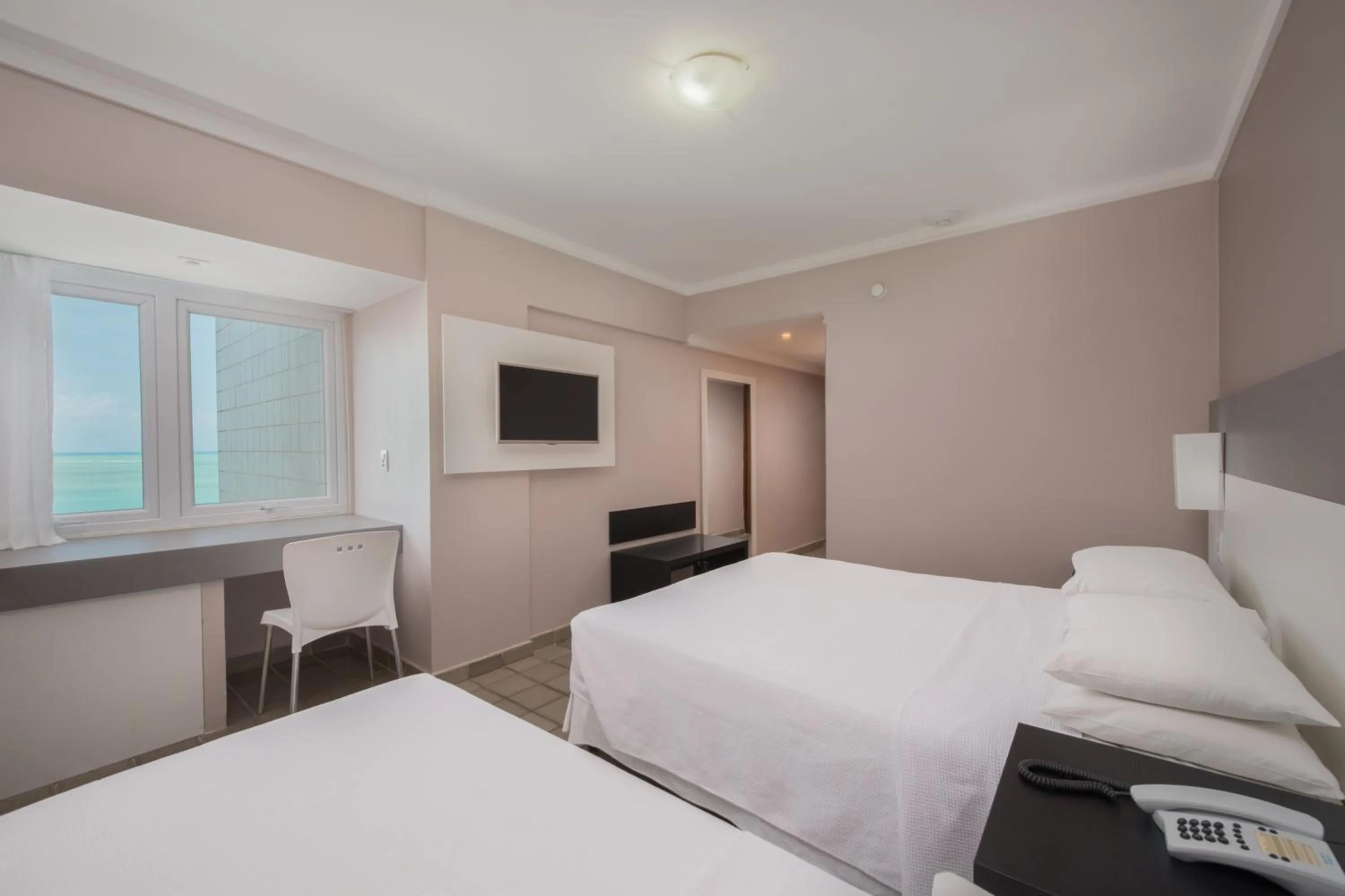 Bed in Hotel Sete Coqueiros