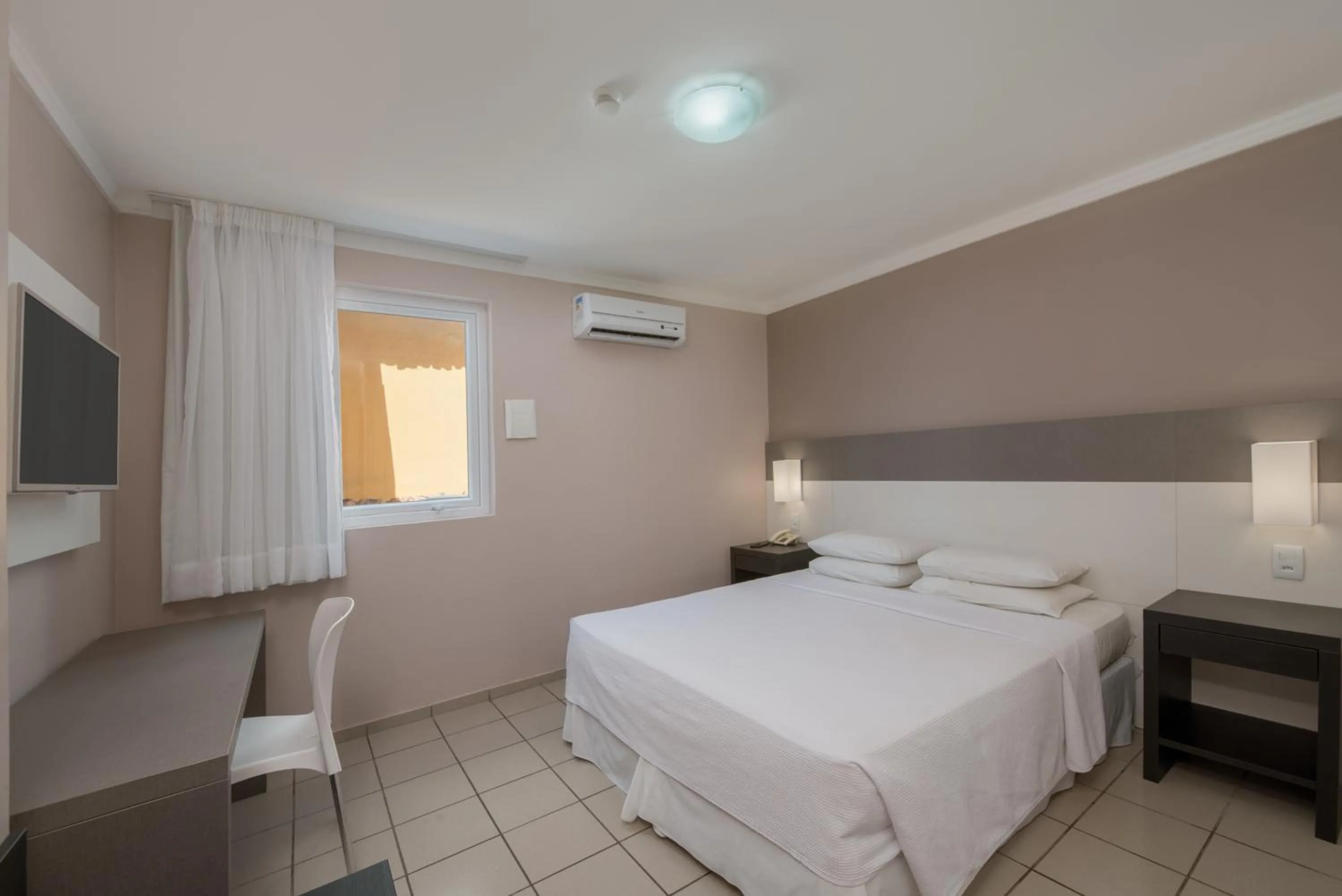 Bed in Hotel Sete Coqueiros