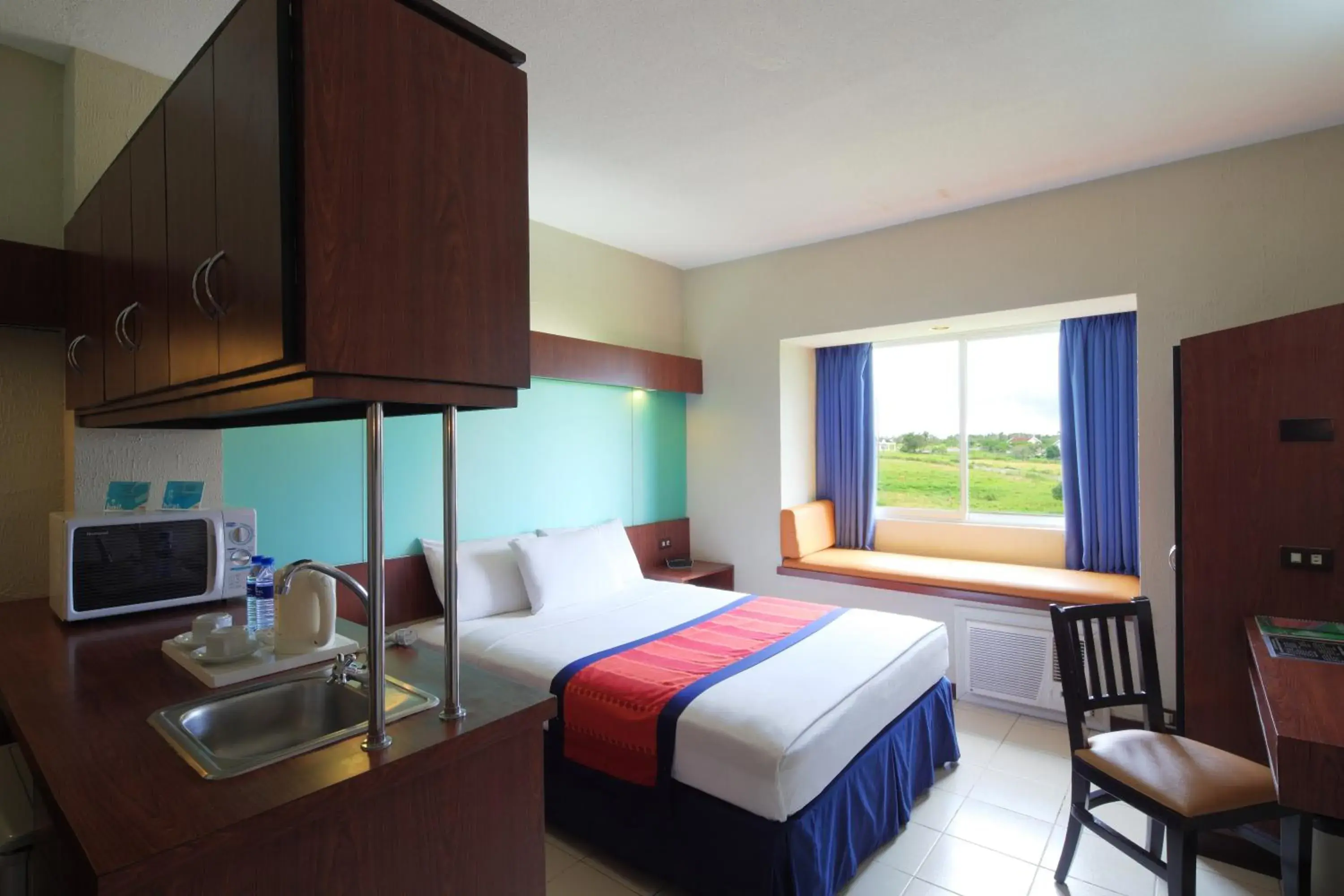 Bedroom, Bed in Microtel by Wyndham Eagle Ridge Bedroom, Bed in Microtel by Wyndham Eagle Ridge