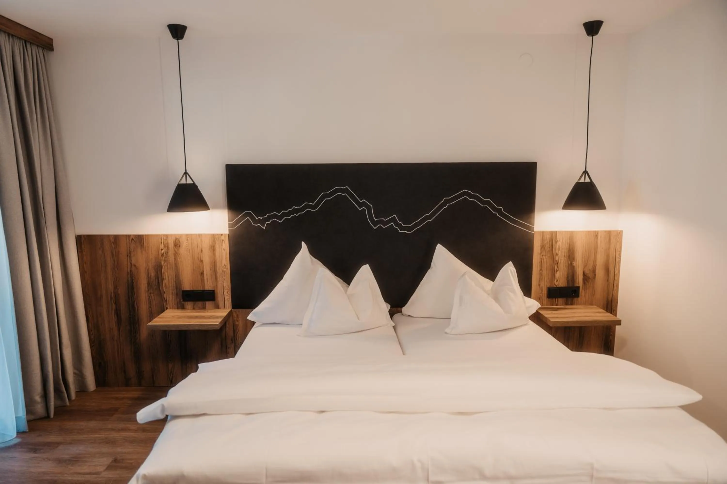 Bed in Hotel Neubergerhof