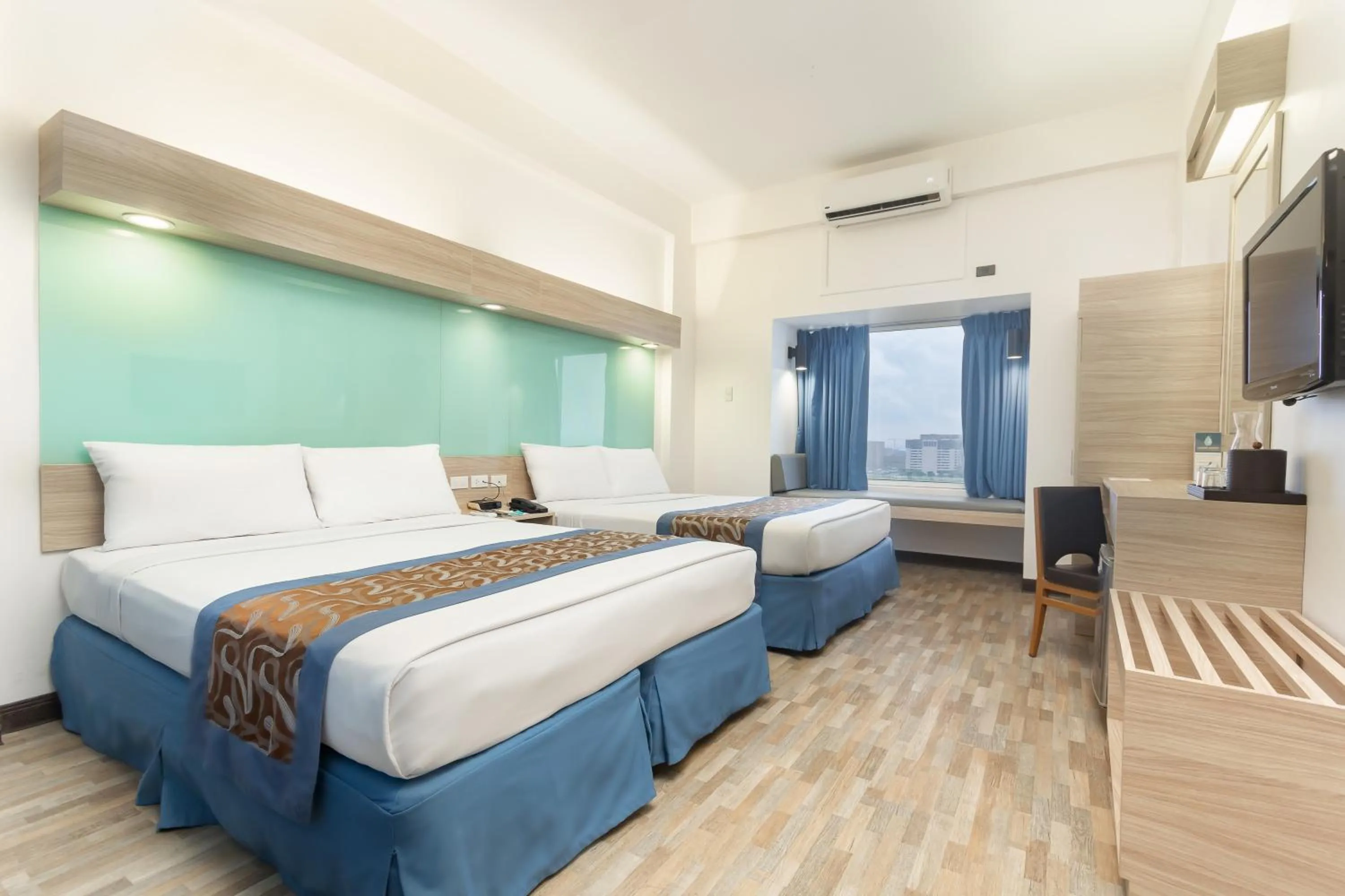 Photo of the whole room, Bed in Microtel by Wyndham Mall of Asia