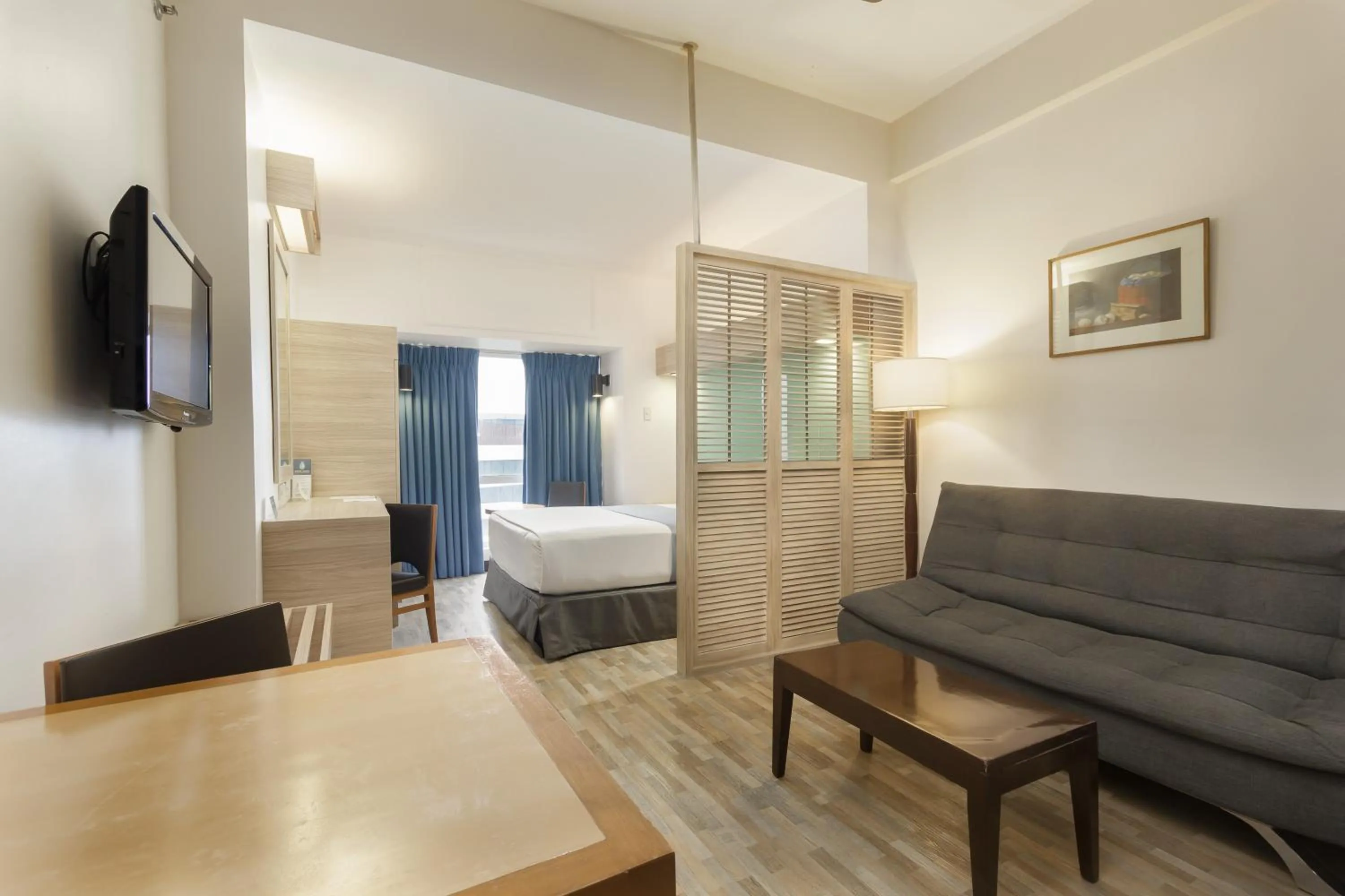 Living room, Bed in Microtel by Wyndham Mall of Asia