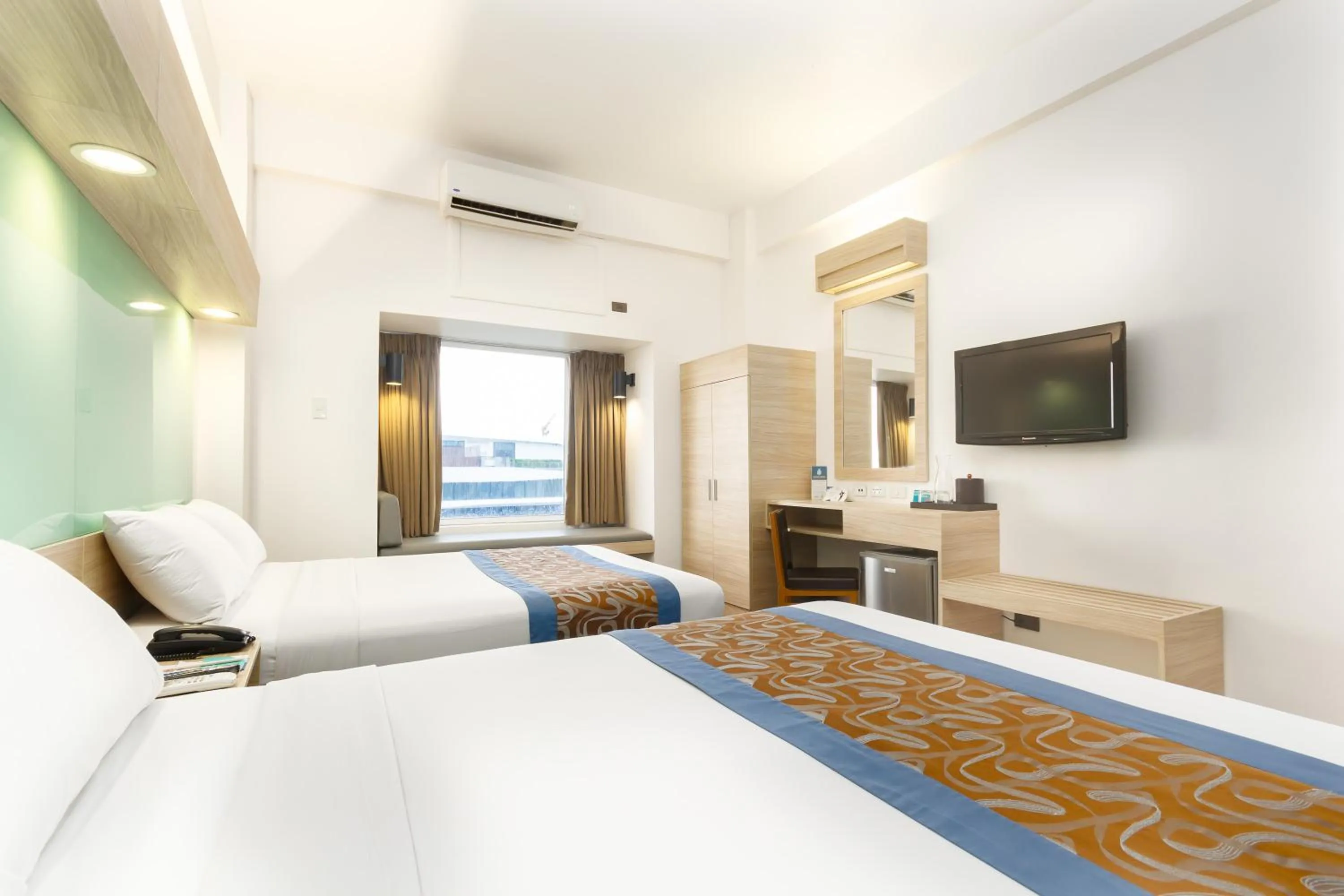 Photo of the whole room, Bed in Microtel by Wyndham Mall of Asia