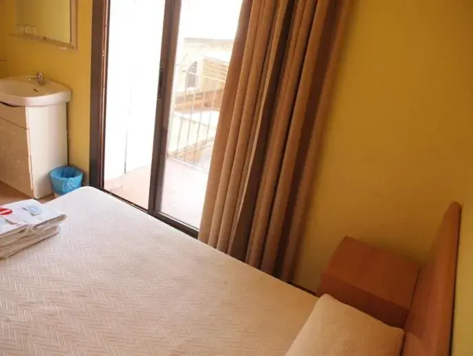 Photo of the whole room, Bed in Hostal Delfos Photo of the whole room, Bed in Hostal Delfos