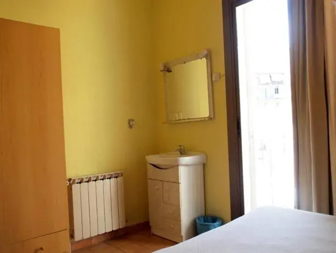 Photo of the whole room, Bed in Hostal Delfos Photo of the whole room, Bed in Hostal Delfos