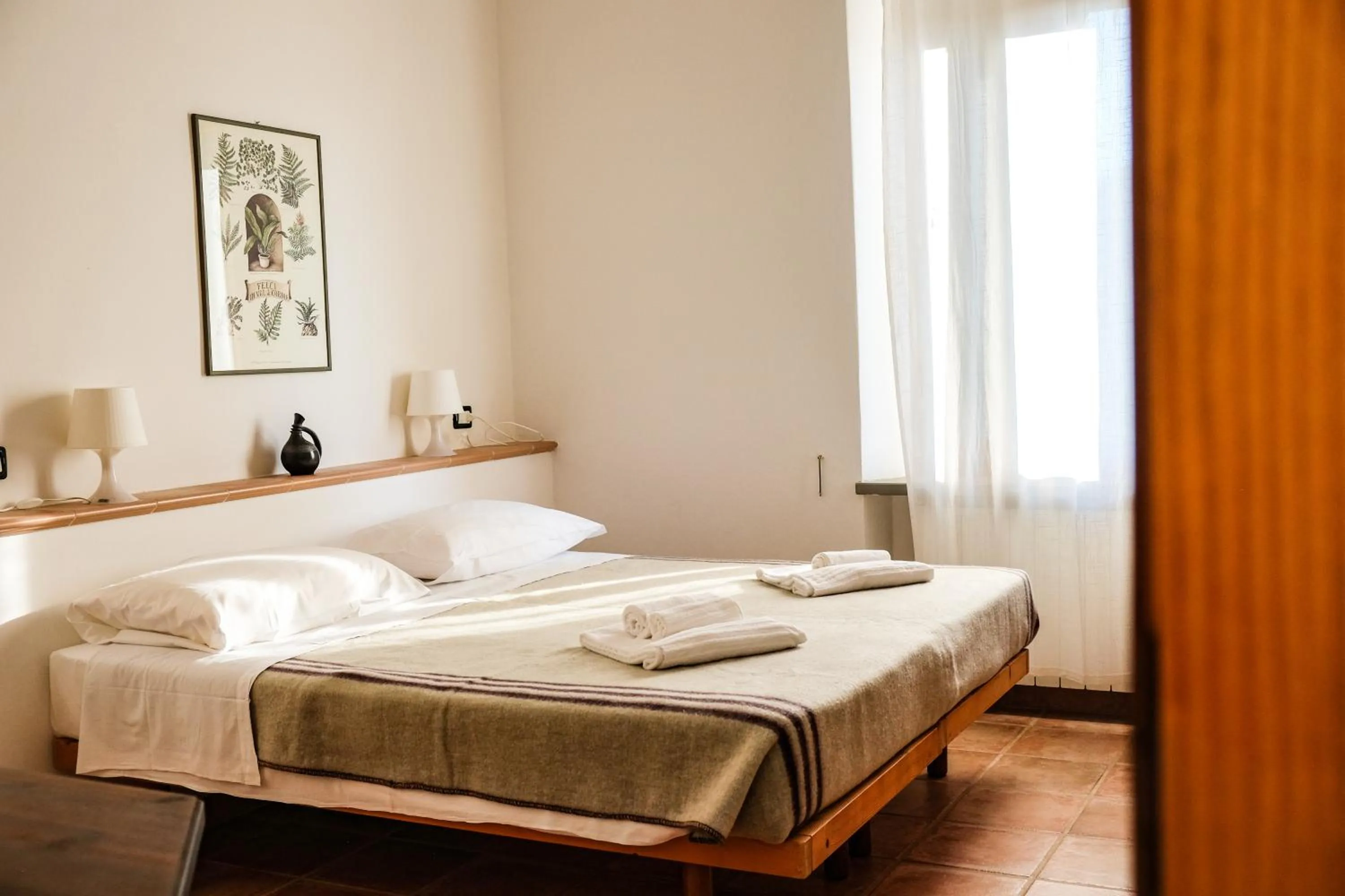 Bedroom, Bed in Agriturismo biologico Bulichella