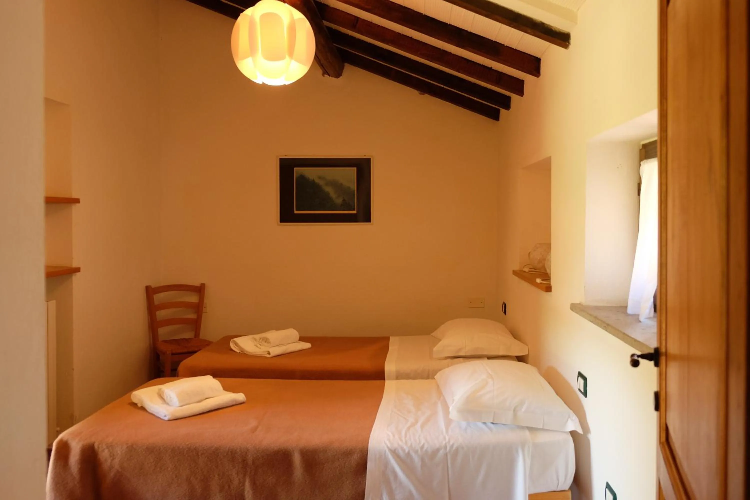 Bedroom, Bed in Agriturismo biologico Bulichella